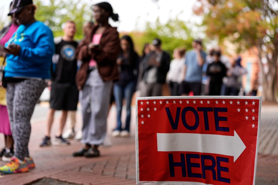 FILE - People stand in line during the last day of early voting, Saturday, Nov. 2, 2024, in Charlotte, N.C. (AP Photo/Mike Stewart, file)