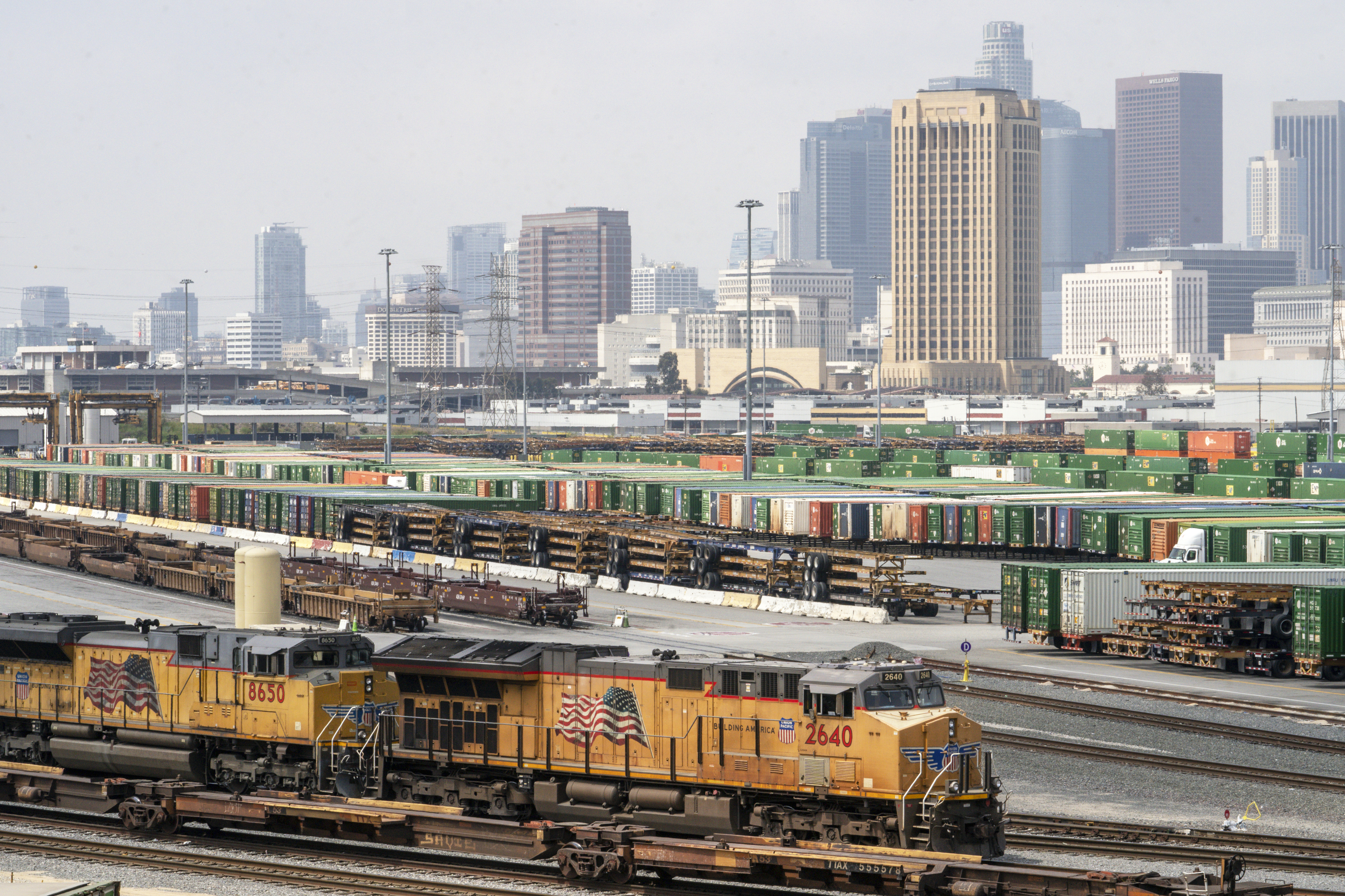FILE - Los Angeles skyline is seen above the Union Pacific LATC Intermodal Terminal is seen on Tuesday, April 25, 2023 in Los Angeles. (AP Photo/Damian Dovarganes, File)
