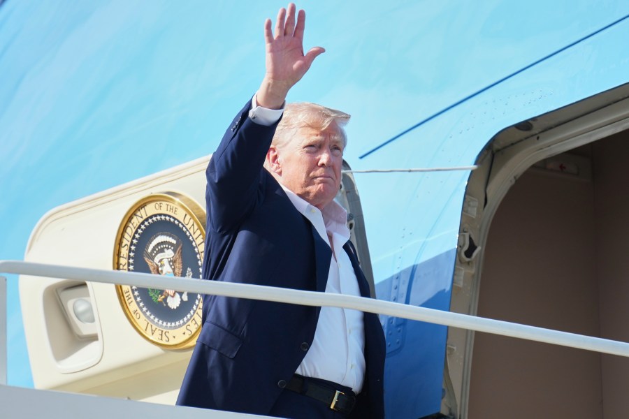 President Donald Trump waves as he boards Air Force One, Tuesday, July 29, 2025, at Royal Air Force Lossiemouth en route to return to Washington. (AP Photo/Jacquelyn Martin)