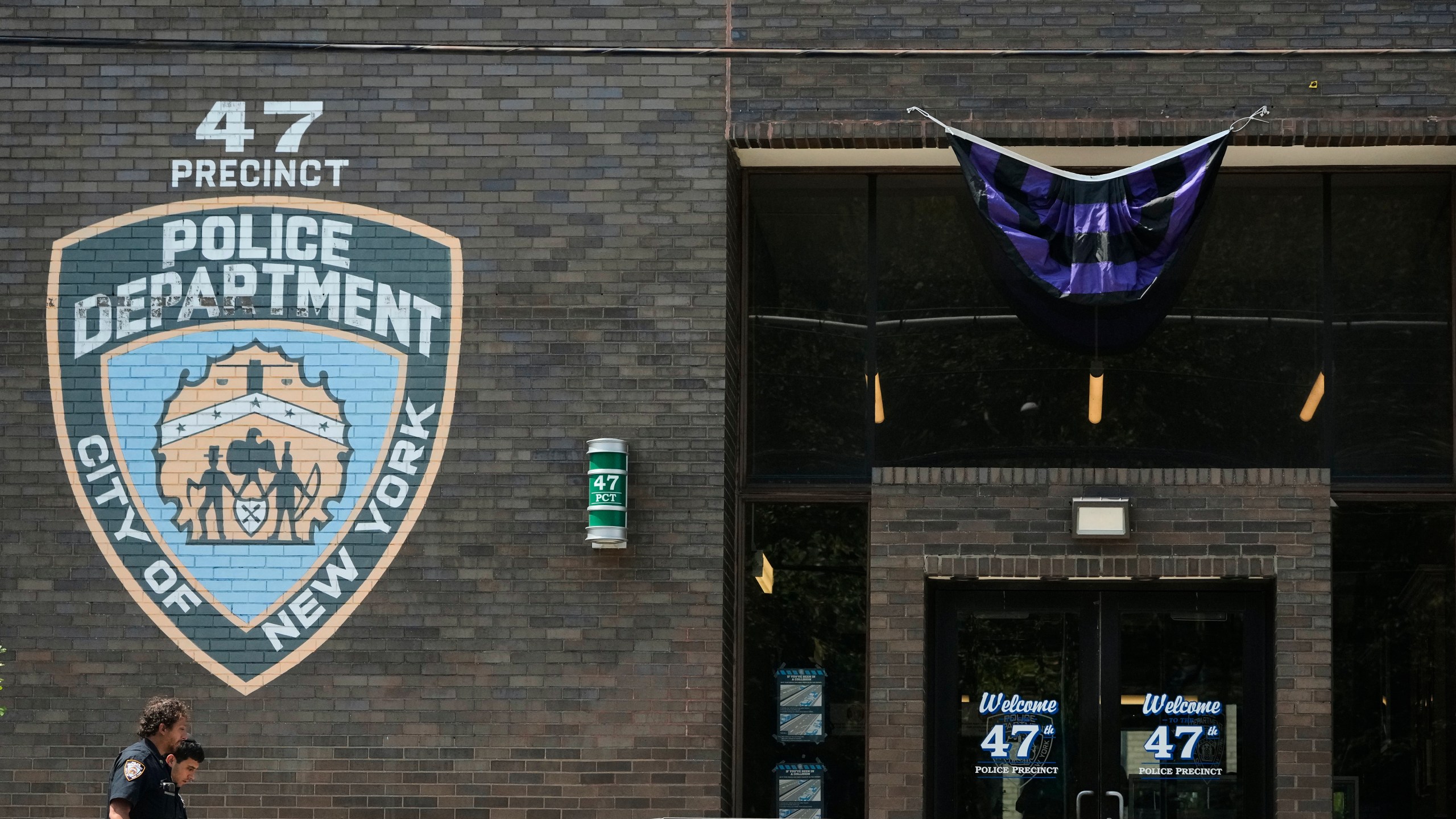 New York Police officers arrive at the NYPD 47th Precinct where NYPD officer Didarul Islam, who was killed Monday, served, in the Bronx borough of New York, Tuesday, July 29, 2025. (AP Photo/Seth Wenig)