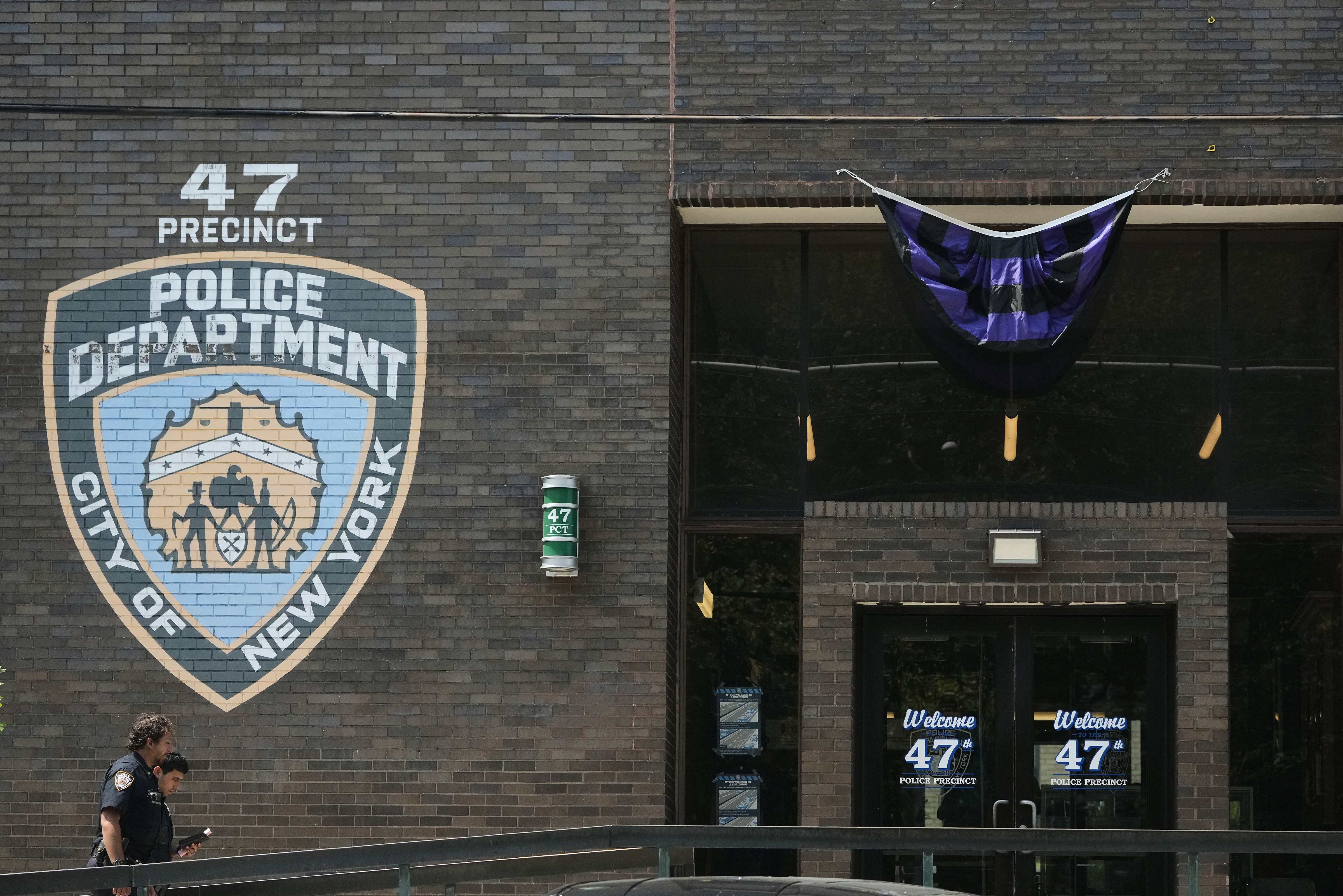 New York Police officers arrive at the NYPD 47th Precinct where NYPD officer Didarul Islam, who was killed Monday, served, in the Bronx borough of New York, Tuesday, July 29, 2025. (AP Photo/Seth Wenig)