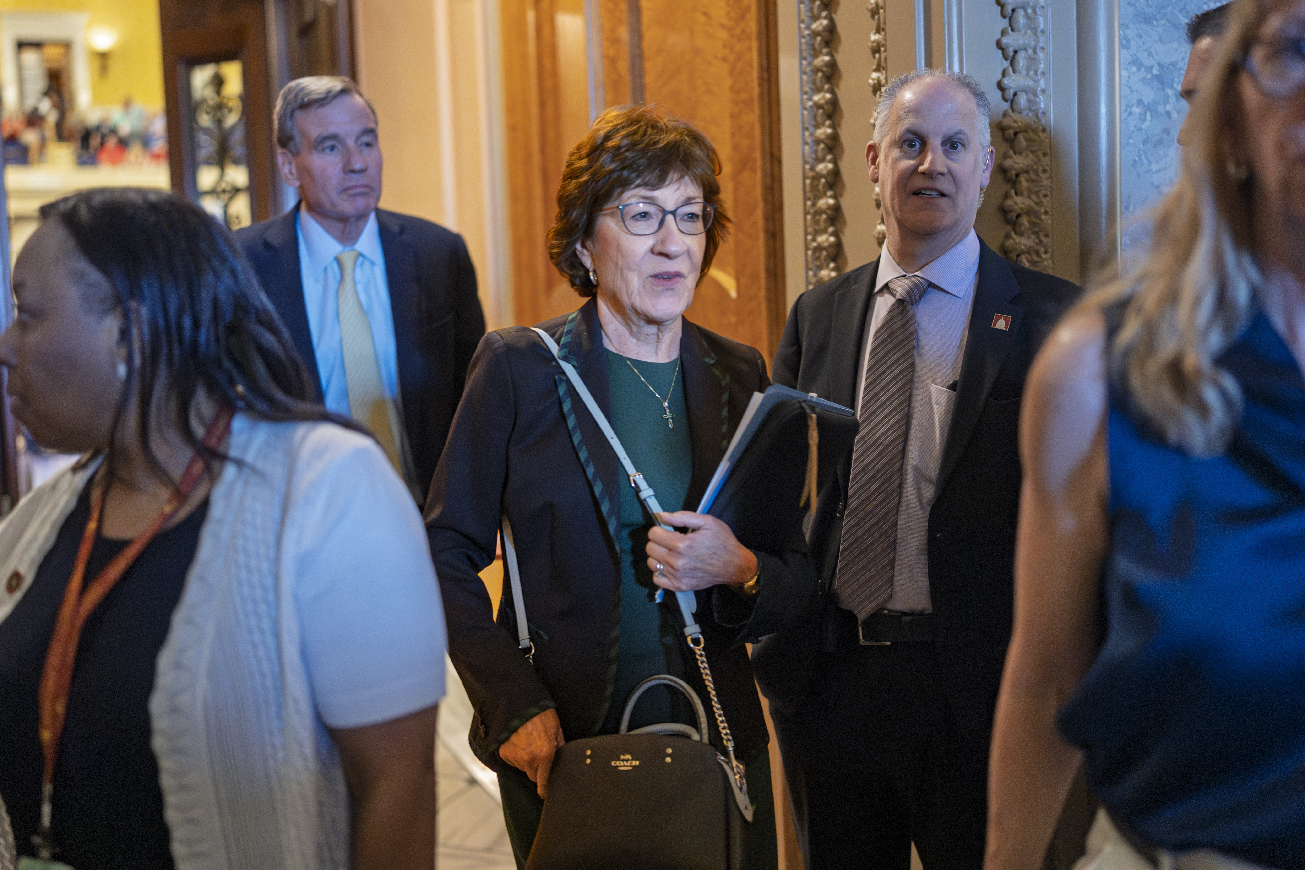 Sen. Susan Collins, R-Maine, departs the chamber as the Senate holds a procedural vote on the nomination of Emil Bove, who served on President Donald Trump's criminal defense team, to be a U.S. Circuit Court judge for the 3rd U.S. Circuit Court of Appeals, at the Capitol in Washington, Thursday, July 24, 2025. (AP Photo/J. Scott Applewhite)