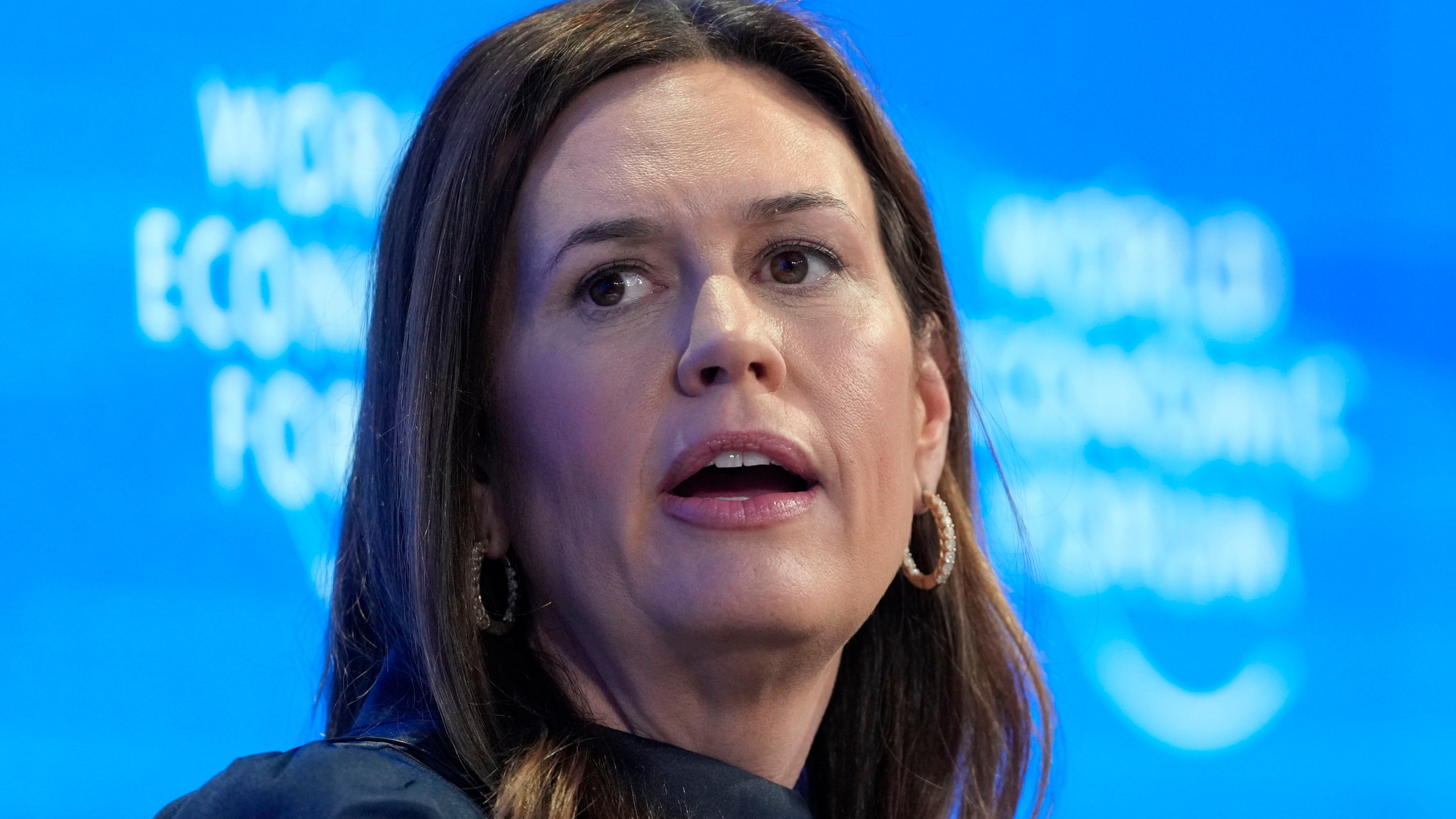 FILE - Arkansas Gov. Sarah Huckabee Sanders speaks at the Annual Meeting of World Economic Forum in Davos, Switzerland, Jan. 23, 2025. (AP Photo/Markus Schreiber, File)