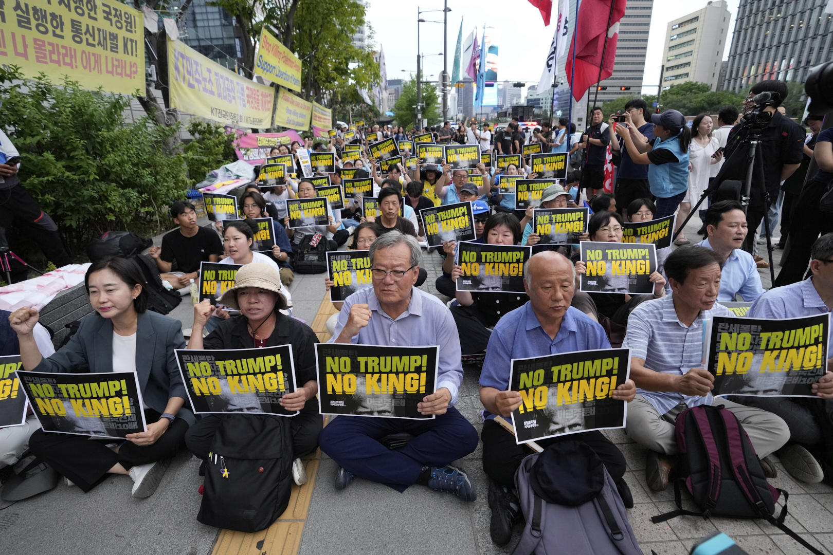 South Korean protesters stage a rally against U.S. President Donald Trump's tariffs policy on South Korea, near the U.S. Embassy in Seoul, South Korea, Wednesday, July 30, 2025. (AP Photo/Ahn Young-joon)