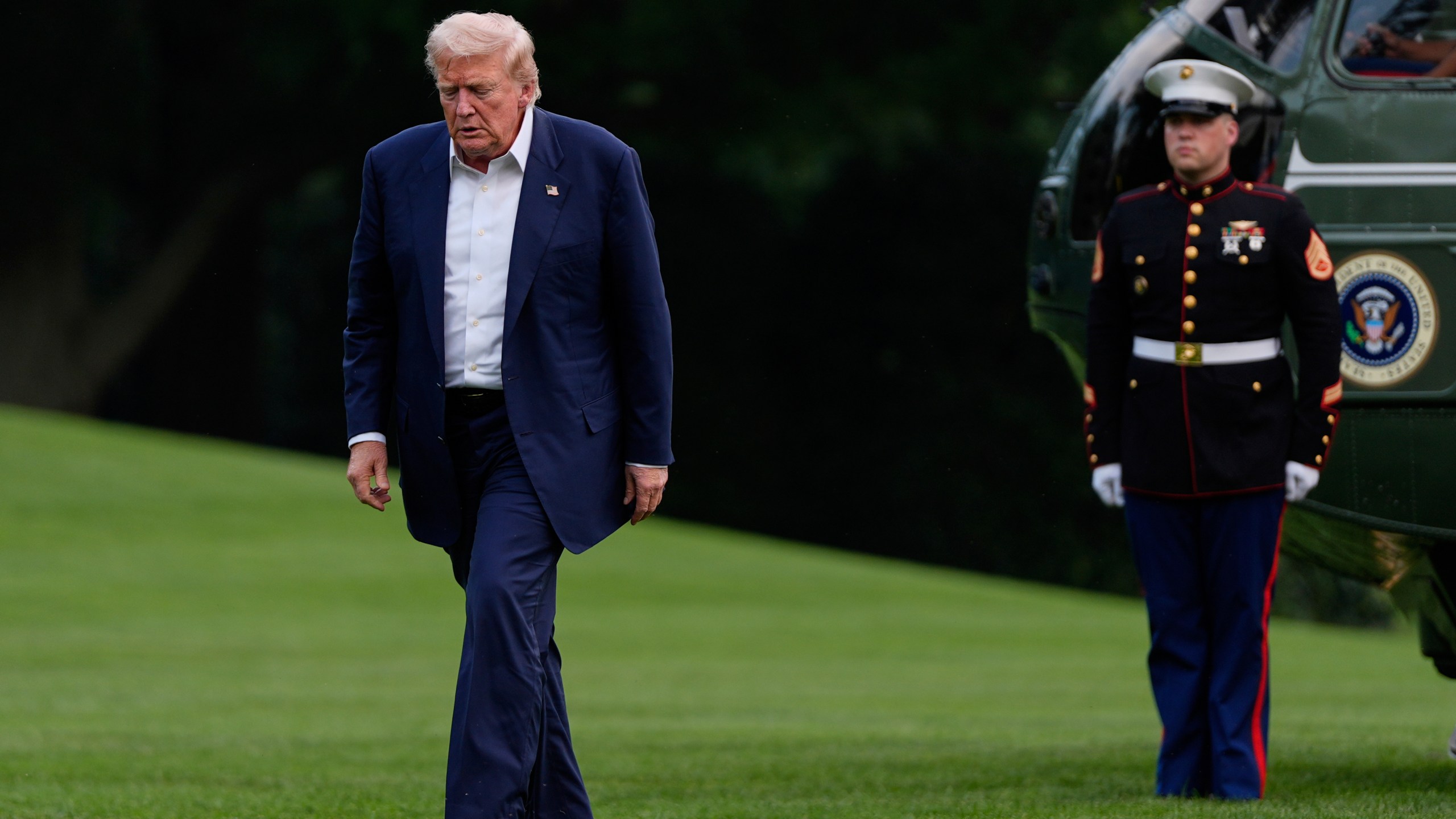 President Donald Trump walks from Marine One after arriving on the South Lawn of the White House, Tuesday, July 29, 2025, in Washington. (AP Photo/Julia Demaree Nikhinson)