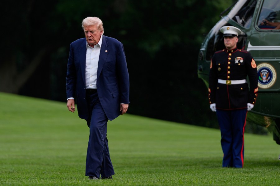 President Donald Trump walks from Marine One after arriving on the South Lawn of the White House, Tuesday, July 29, 2025, in Washington. (AP Photo/Julia Demaree Nikhinson)