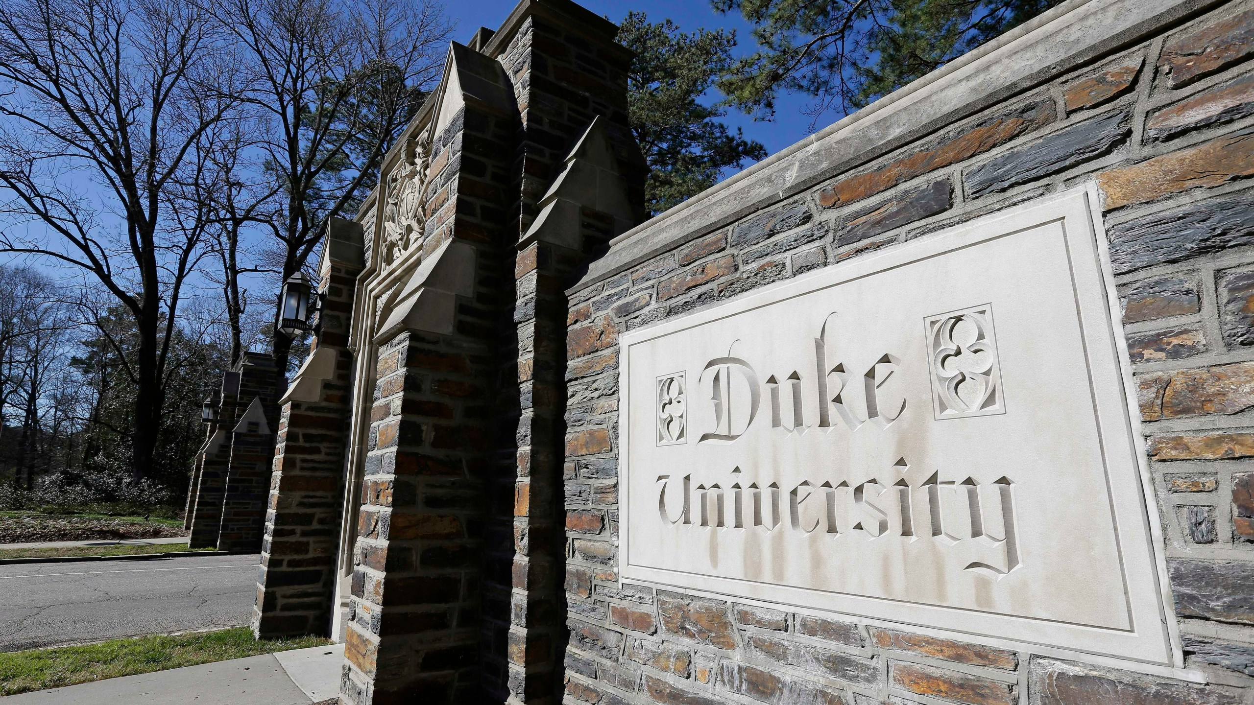 FILE - This Jan. 28, 2019 file photo shows the entrance to the main Duke University campus in Durham, N.C. (AP Photo/Gerry Broome, File)