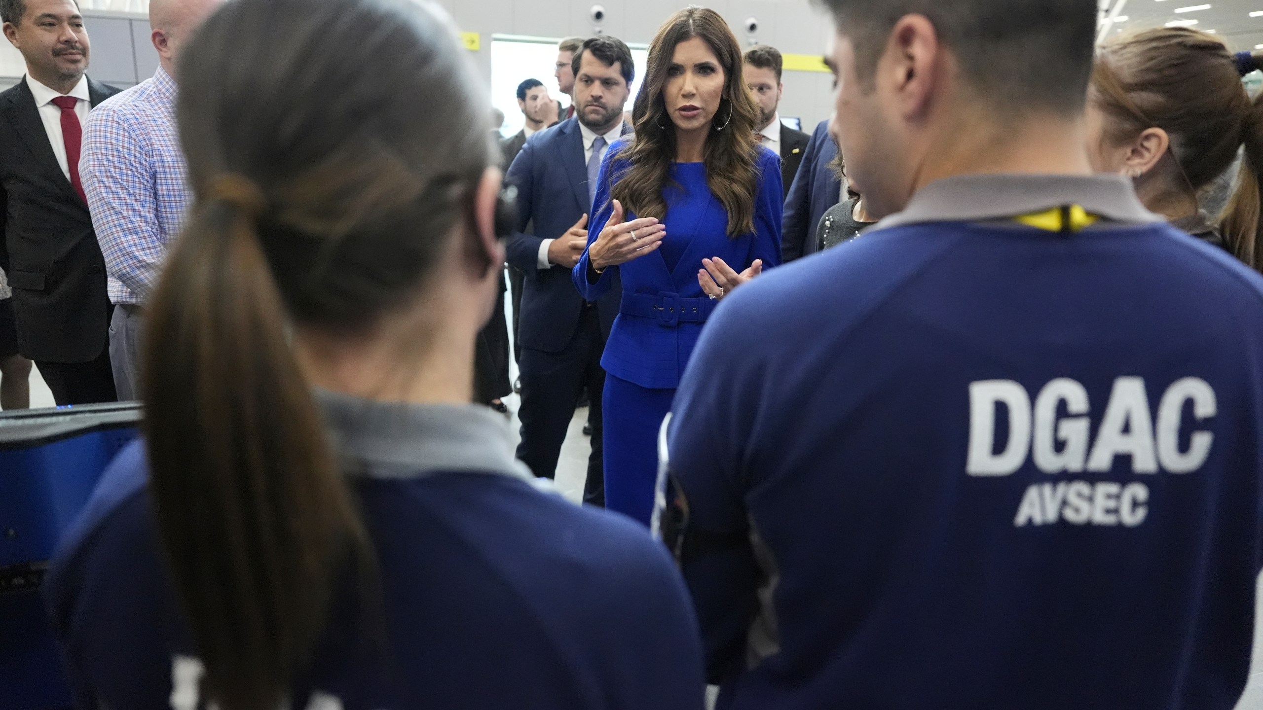 U.S. Homeland Security Secretary Kristi Noem attends a security demonstration related to TSA screening and a Biometric Identification Transnational Migration Alert Program (BITMAP) at Arturo Merino Benitez International Airport before departing Santiago, Chile, Wednesday, July 30, 2025. (AP Photo/Alex Brandon, Pool)
