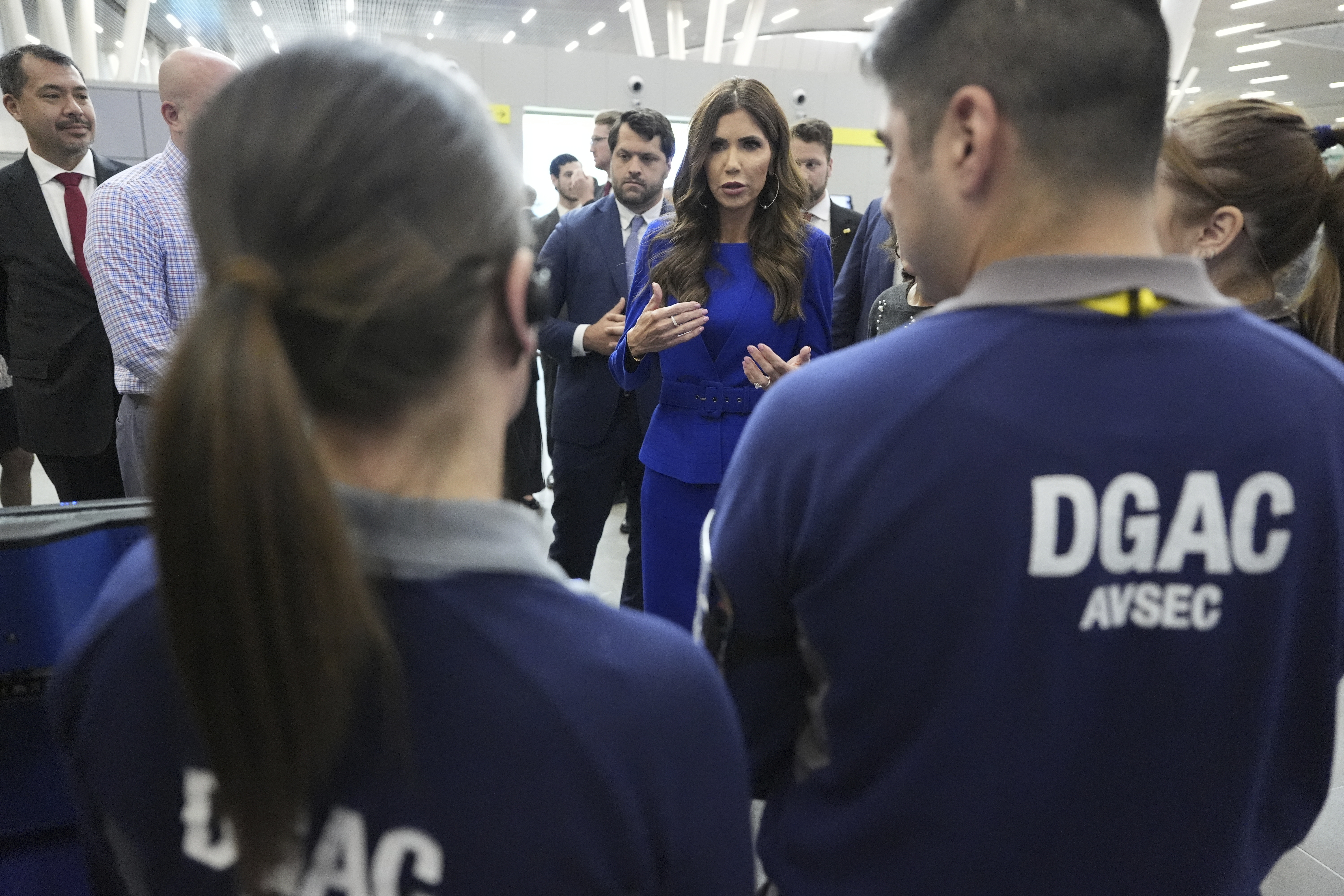 U.S. Homeland Security Secretary Kristi Noem attends a security demonstration related to TSA screening and a Biometric Identification Transnational Migration Alert Program (BITMAP) at Arturo Merino Benitez International Airport before departing Santiago, Chile, Wednesday, July 30, 2025. (AP Photo/Alex Brandon, Pool)