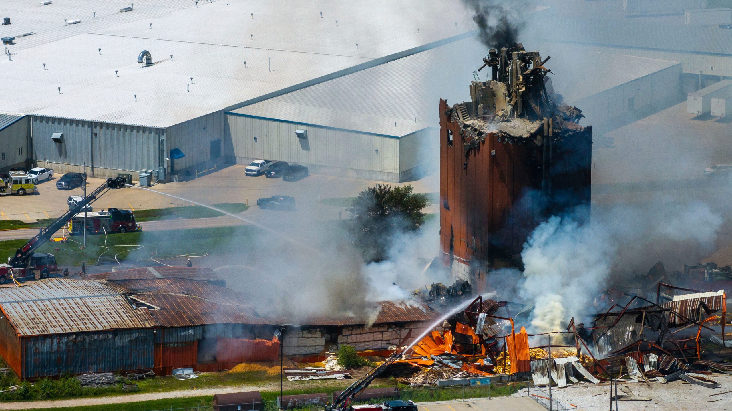 Firefighters battle a fire after an explosion in an industrial area in Fremont, Neb., Tuesday, July 29, 2025. (Chris Machian/Omaha World-Herald via AP)