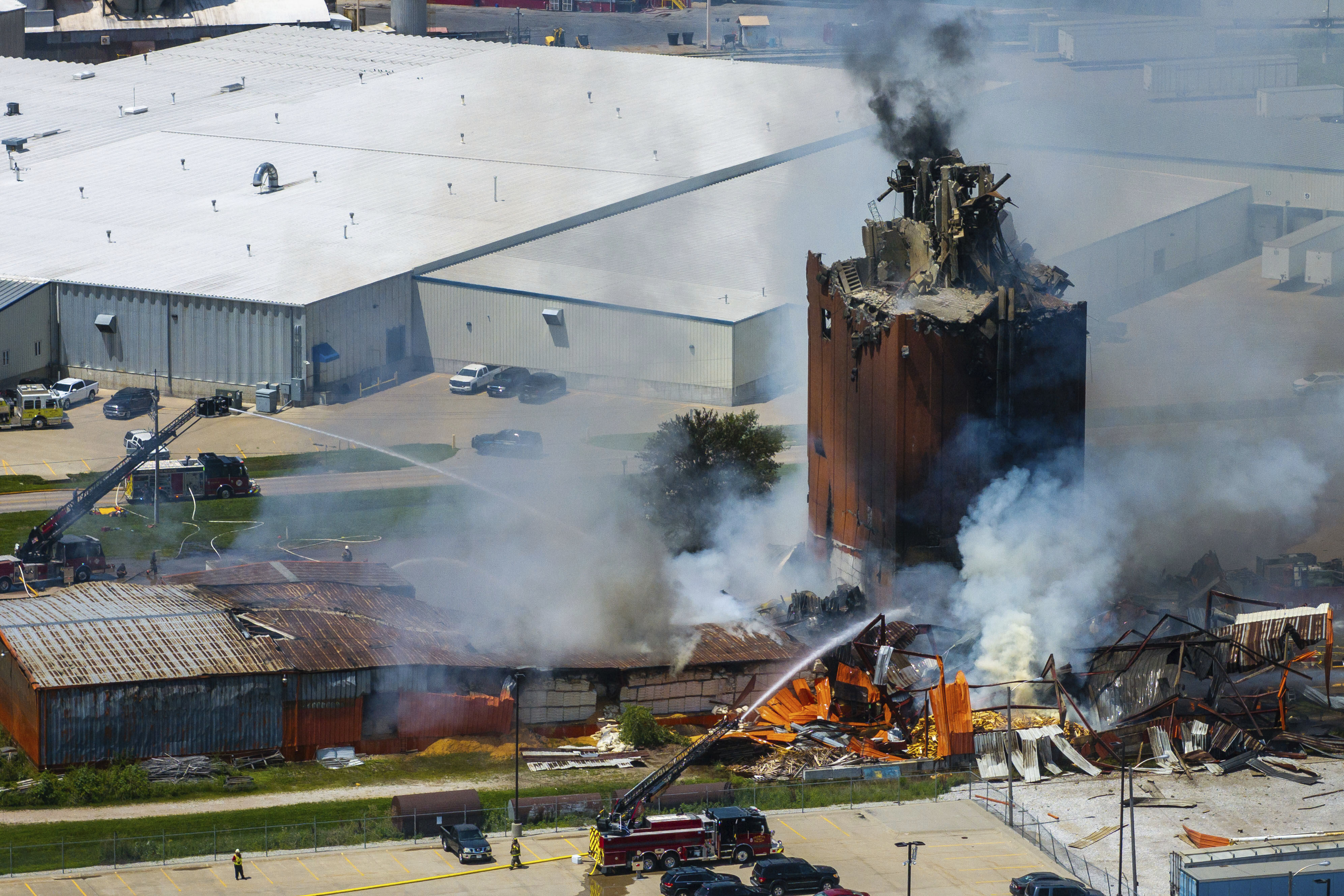 Firefighters battle a fire after an explosion in an industrial area in Fremont, Neb., Tuesday, July 29, 2025. (Chris Machian/Omaha World-Herald via AP)