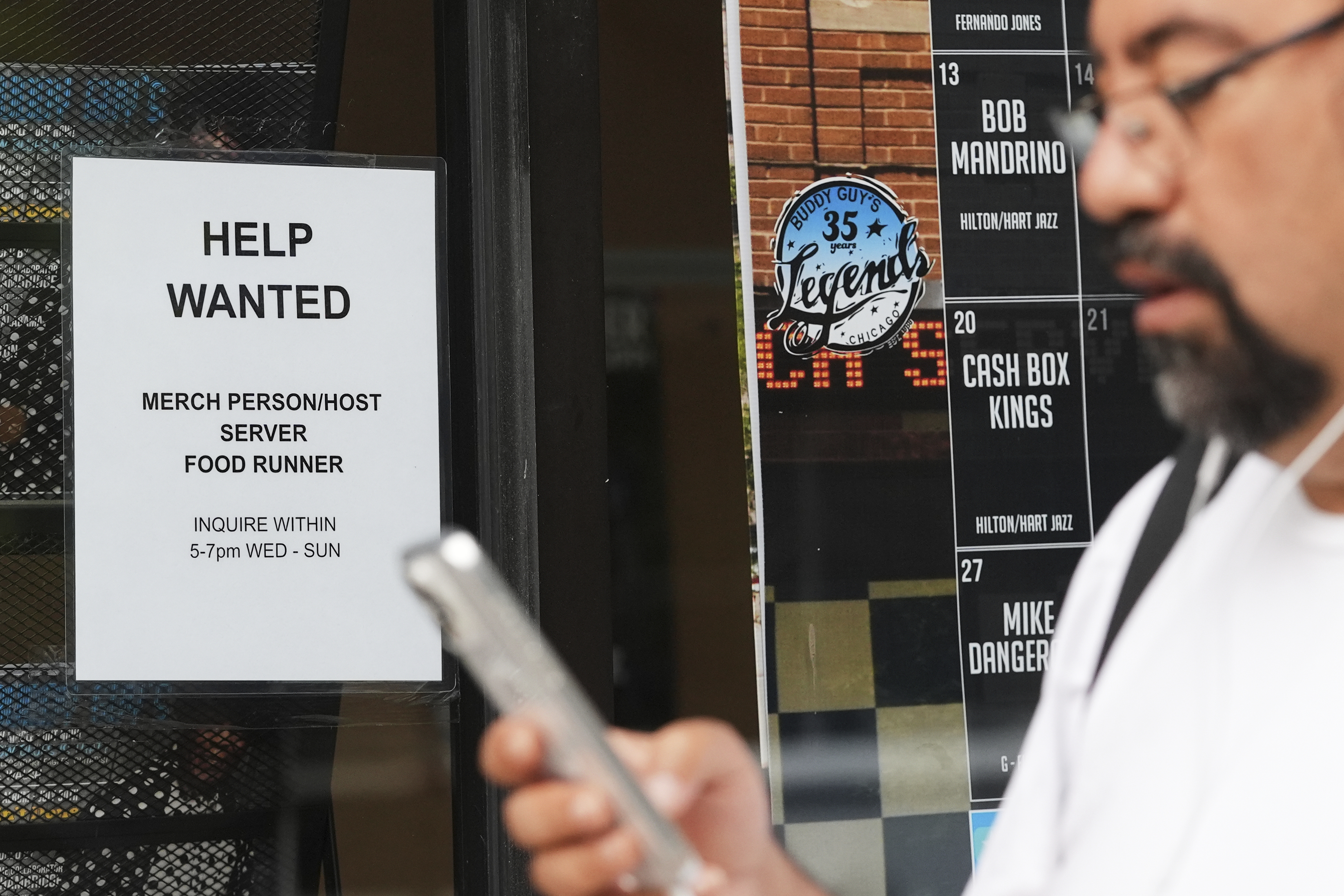 Help wanted sign is displayed at a live music and blues club in Chicago, Thursday, July 24, 2025. (AP Photo/Nam Y. Huh)