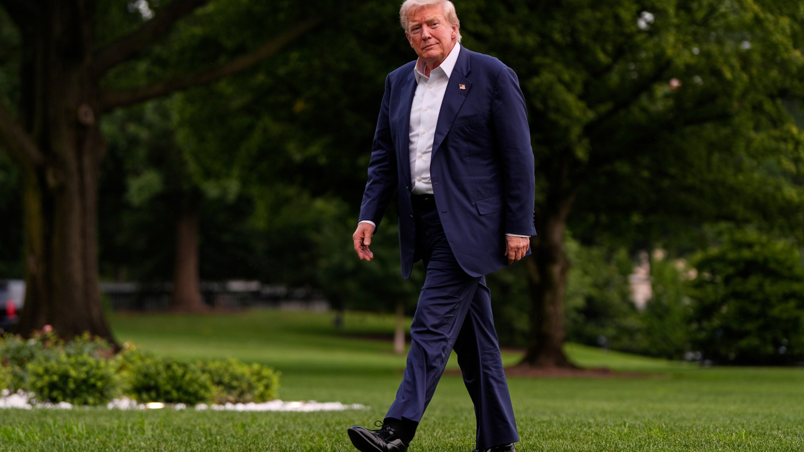President Donald Trump walks from Marine One after arriving on the South Lawn of the White House, Tuesday, July 29, 2025, in Washington. (AP Photo/Julia Demaree Nikhinson)