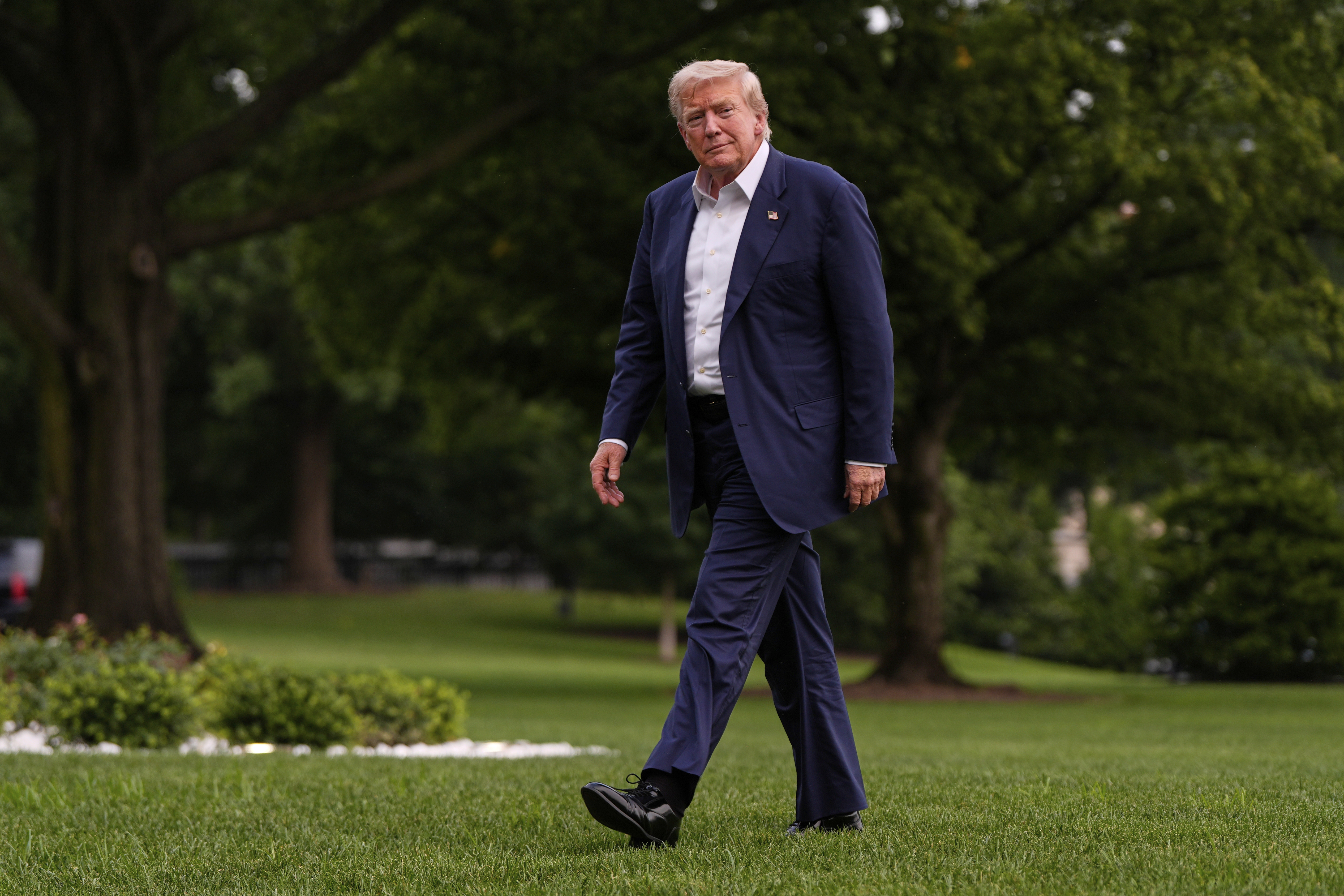 President Donald Trump walks from Marine One after arriving on the South Lawn of the White House, Tuesday, July 29, 2025, in Washington. (AP Photo/Julia Demaree Nikhinson)