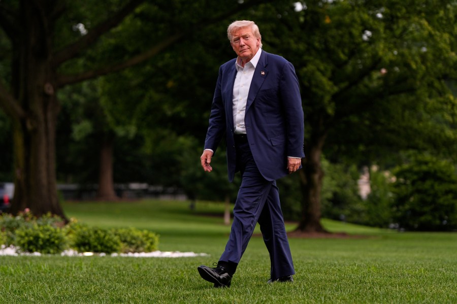 President Donald Trump walks from Marine One after arriving on the South Lawn of the White House, Tuesday, July 29, 2025, in Washington. (AP Photo/Julia Demaree Nikhinson)