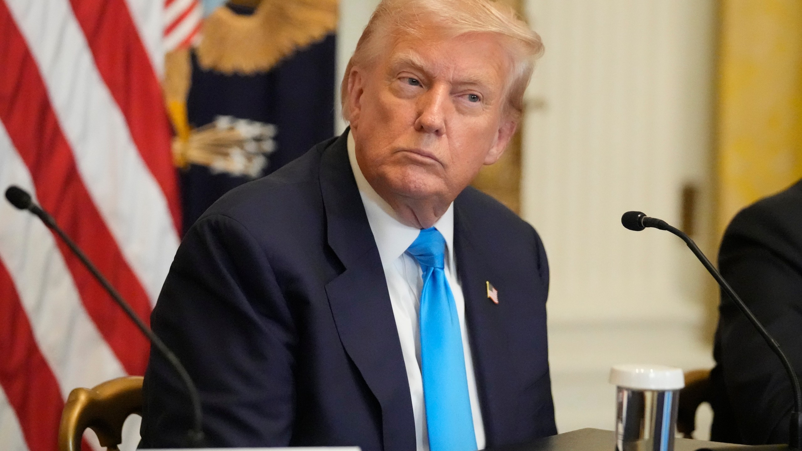 President Donald Trump listens at an event to promote his proposal to improve Americans' access to their medical records in the East Room of the White House, Wednesday, July 30, 2025, in Washington. (AP Photo/Mark Schiefelbein)
