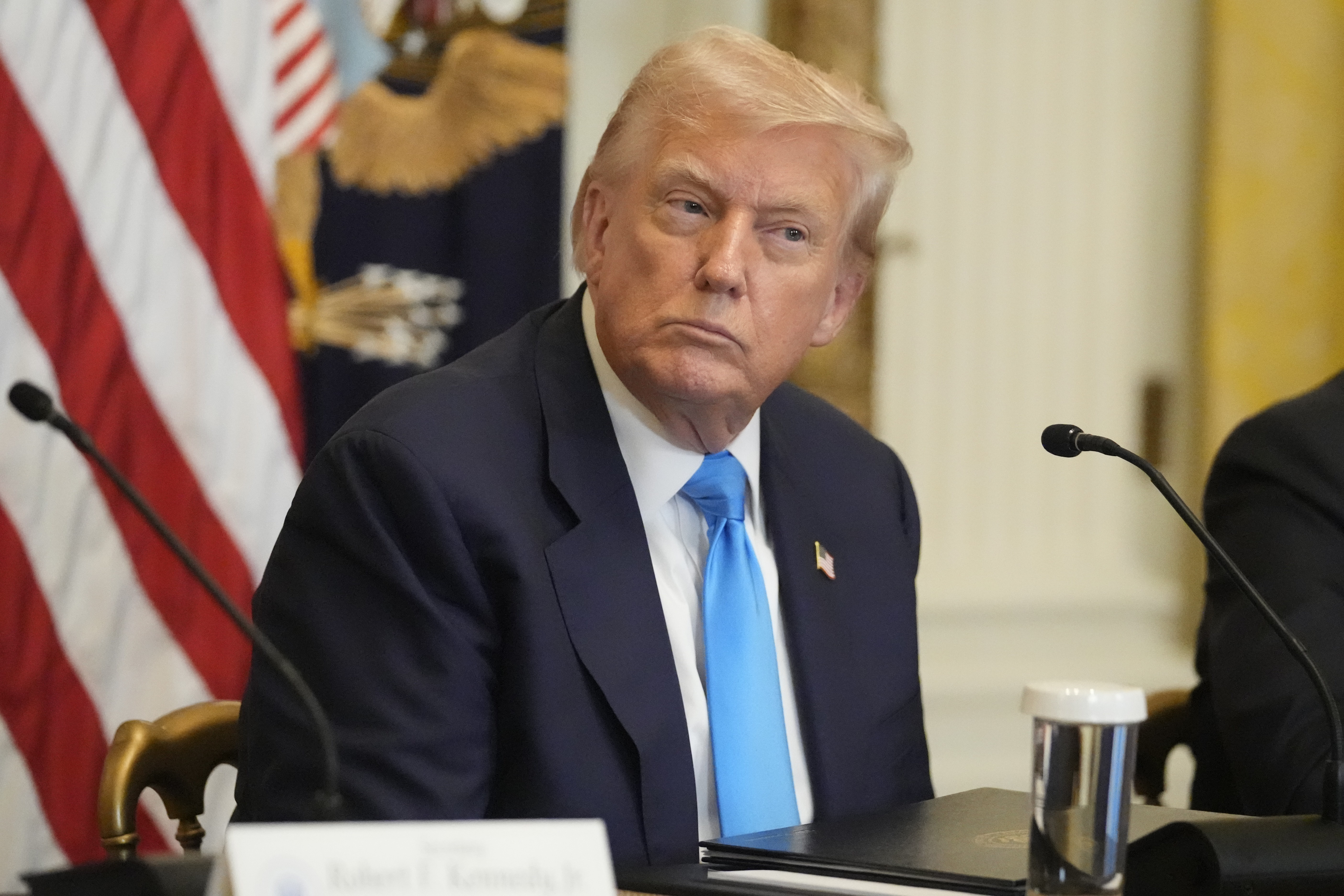 President Donald Trump listens at an event to promote his proposal to improve Americans' access to their medical records in the East Room of the White House, Wednesday, July 30, 2025, in Washington. (AP Photo/Mark Schiefelbein)