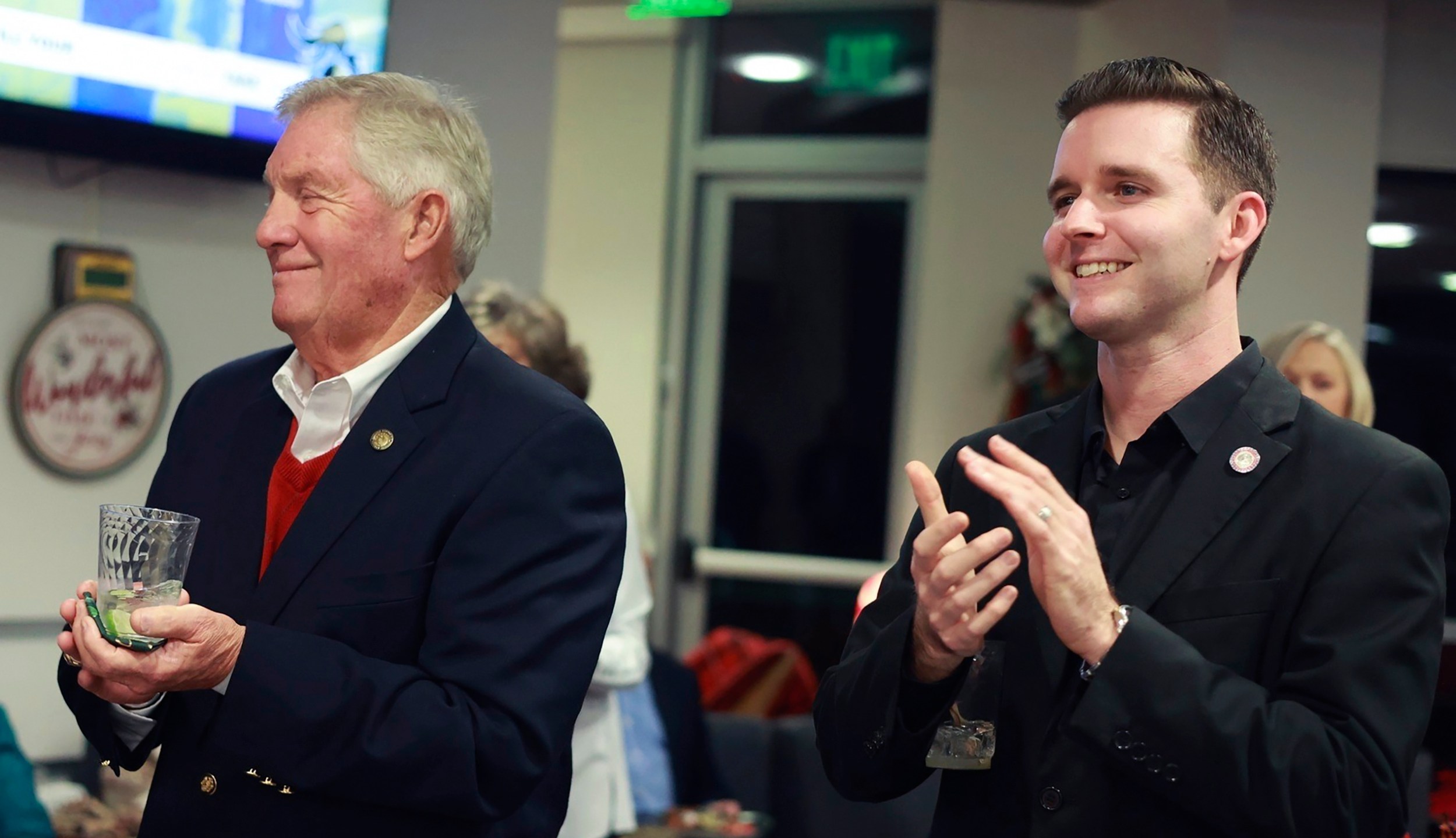 Pittsylvania County Board of Supervisors member Kenneth Bowman, left, and Danville council member Lee Vogler attend the Danville Community College Education Foundation Holiday Gathering in Danville, Va., Dec. 2024. (Von Wellington Photography via AP)