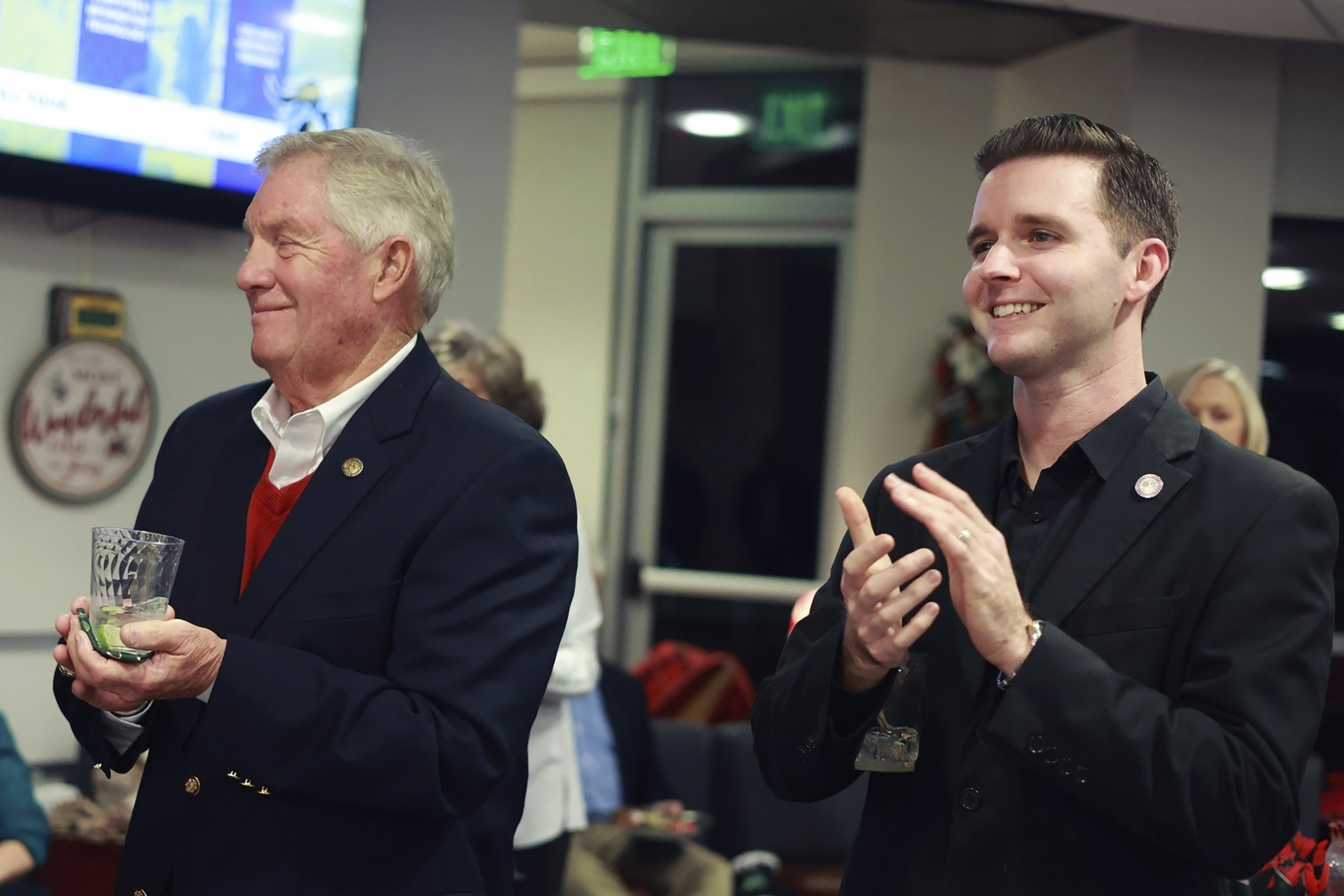 Pittsylvania County Board of Supervisors member Kenneth Bowman, left, and Danville council member Lee Vogler attend the Danville Community College Education Foundation Holiday Gathering in Danville, Va., Dec. 2024. (Von Wellington Photography via AP)