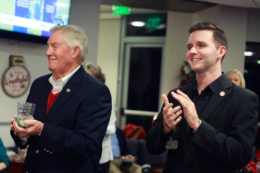 Pittsylvania County Board of Supervisors member Kenneth Bowman, left, and Danville council member Lee Vogler attend the Danville Community College Education Foundation Holiday Gathering in Danville, Va., Dec. 2024. (Von Wellington Photography via AP)