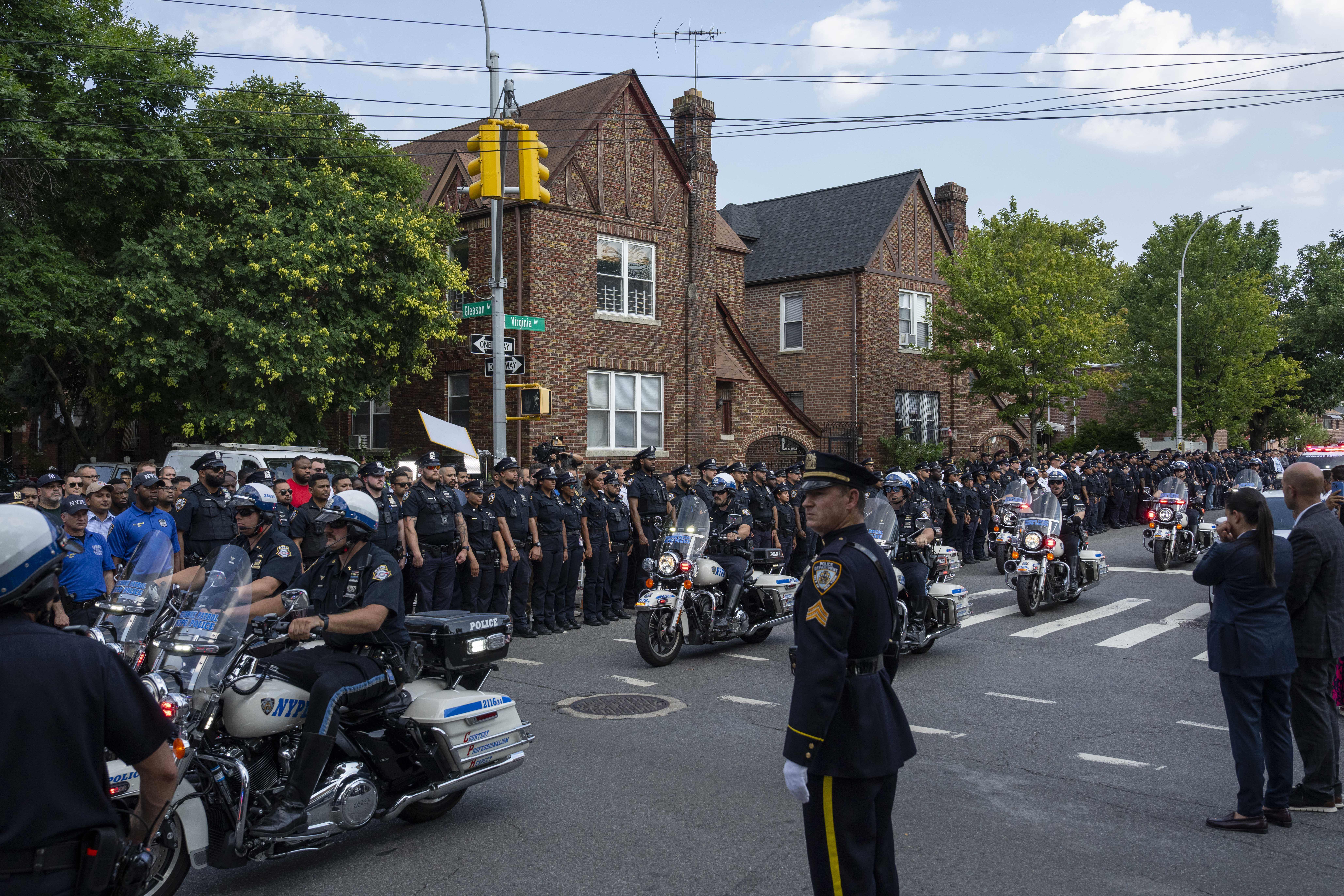 NYPD officers on motorcycle escorting an ambulance carrying a casket of NYPD Officer Didarul Islam arrive at Parkchester Jame Masjid after Monday's deadly shooting, Tuesday, July 29, 2025, in New York. (AP Photo/Yuki Iwamura)