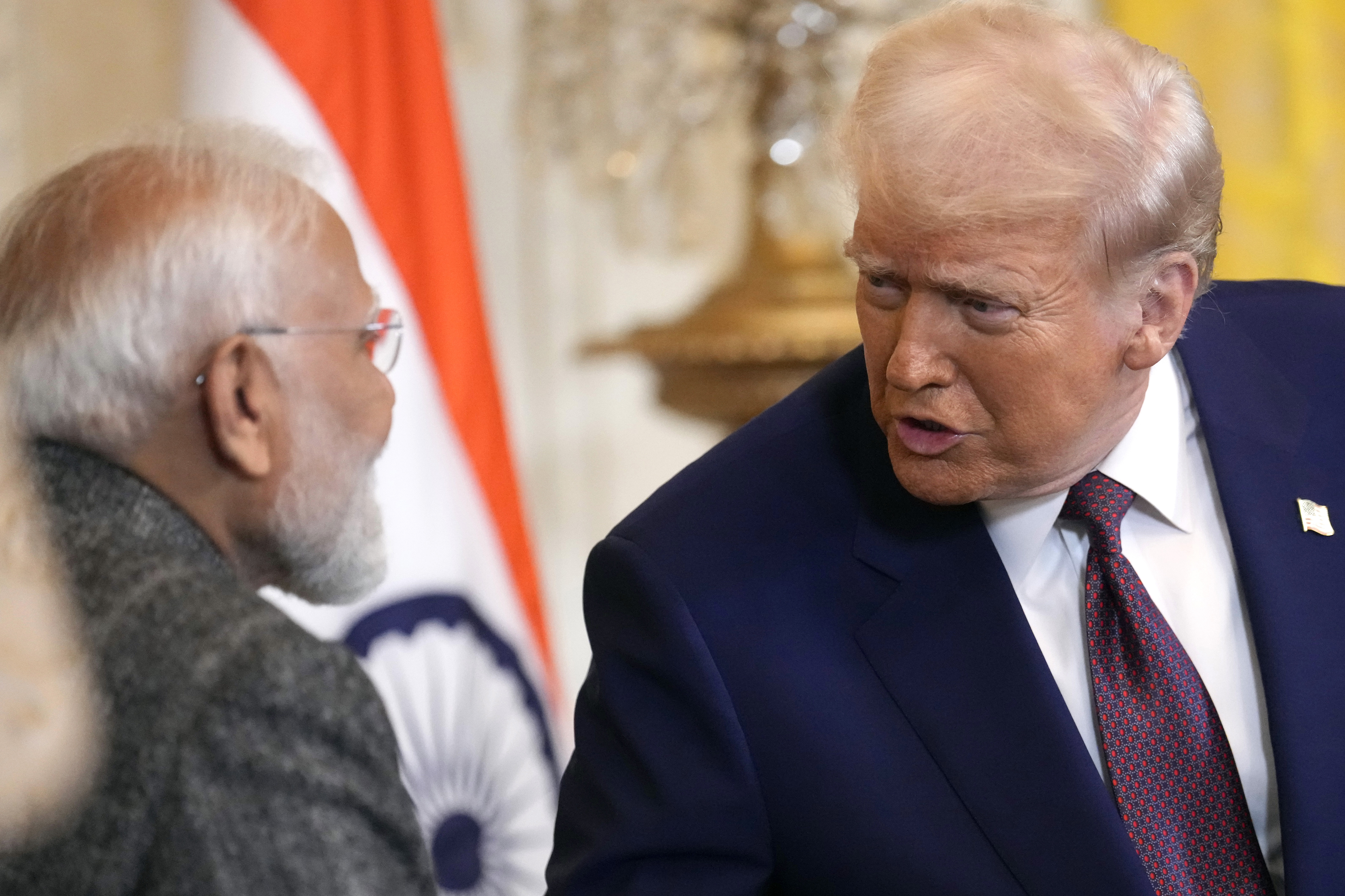 FILE - President Donald Trump, right, speaks with India's Prime Minister Narendra Modi during a news conference in the East Room of the White House, Feb. 13, 2025, in Washington. (AP Photo/Ben Curtis, File)
