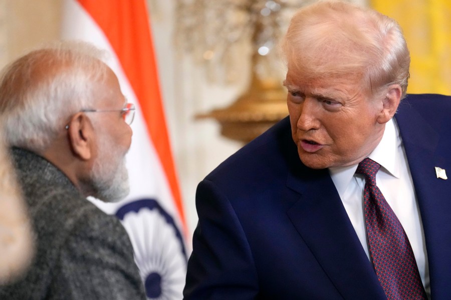 FILE - President Donald Trump, right, speaks with India's Prime Minister Narendra Modi during a news conference in the East Room of the White House, Feb. 13, 2025, in Washington. (AP Photo/Ben Curtis, File)