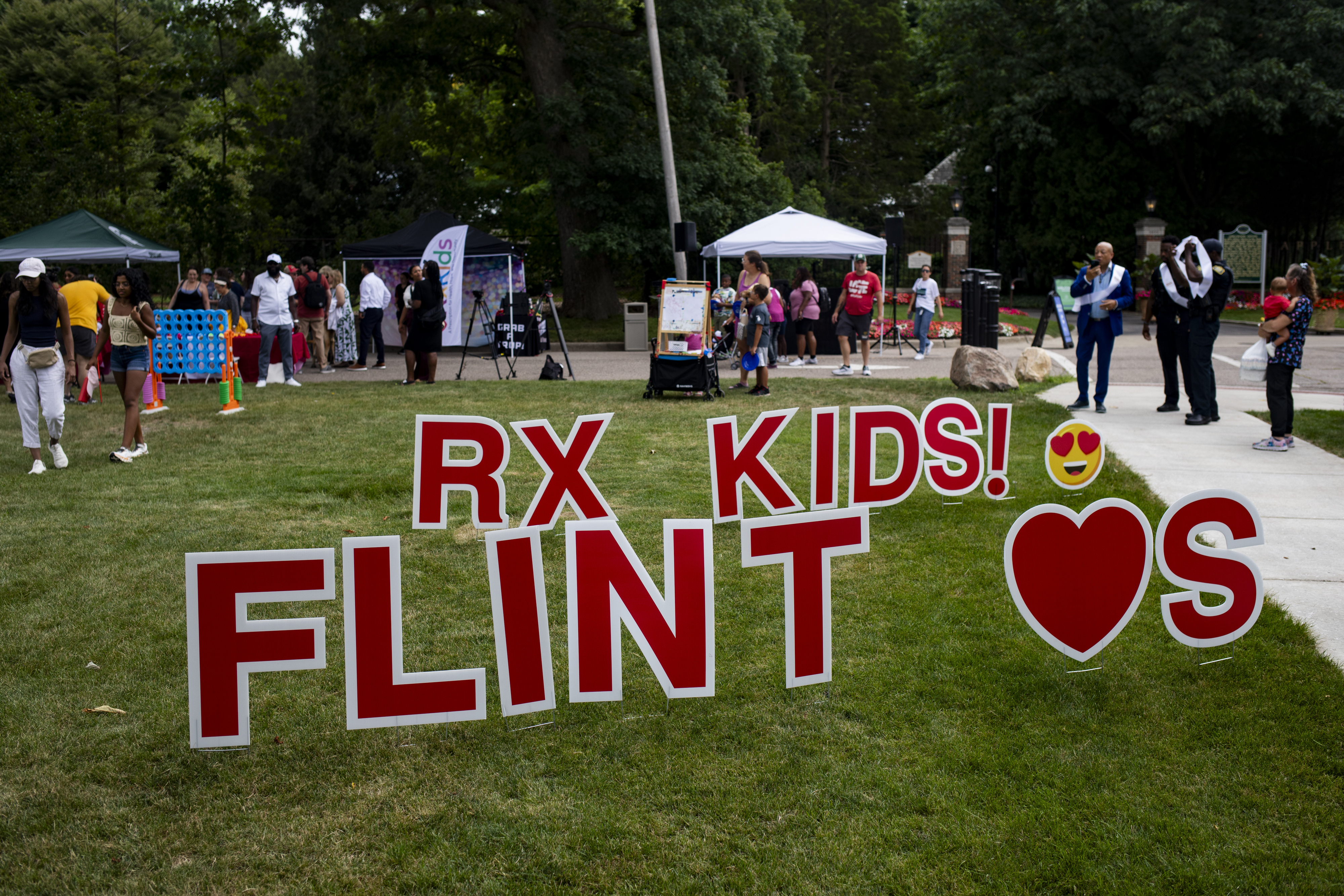 Families and community members arrive for the Flint Rx Kids Baby Parade event on July 25, 2025 on the Applewood Campus in Flint, Michigan. The event celebrates the continued impact of Rx Kids on Flint families and babies. (AP Photo/Emily Elconin)