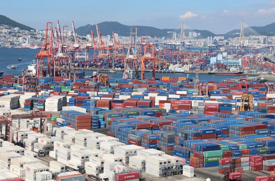 Cranes and shipping containers are seen at a port in Busan, South Korea, Thursday, July 31, 2025. (Gang Seon-bae/Yonhap via AP)