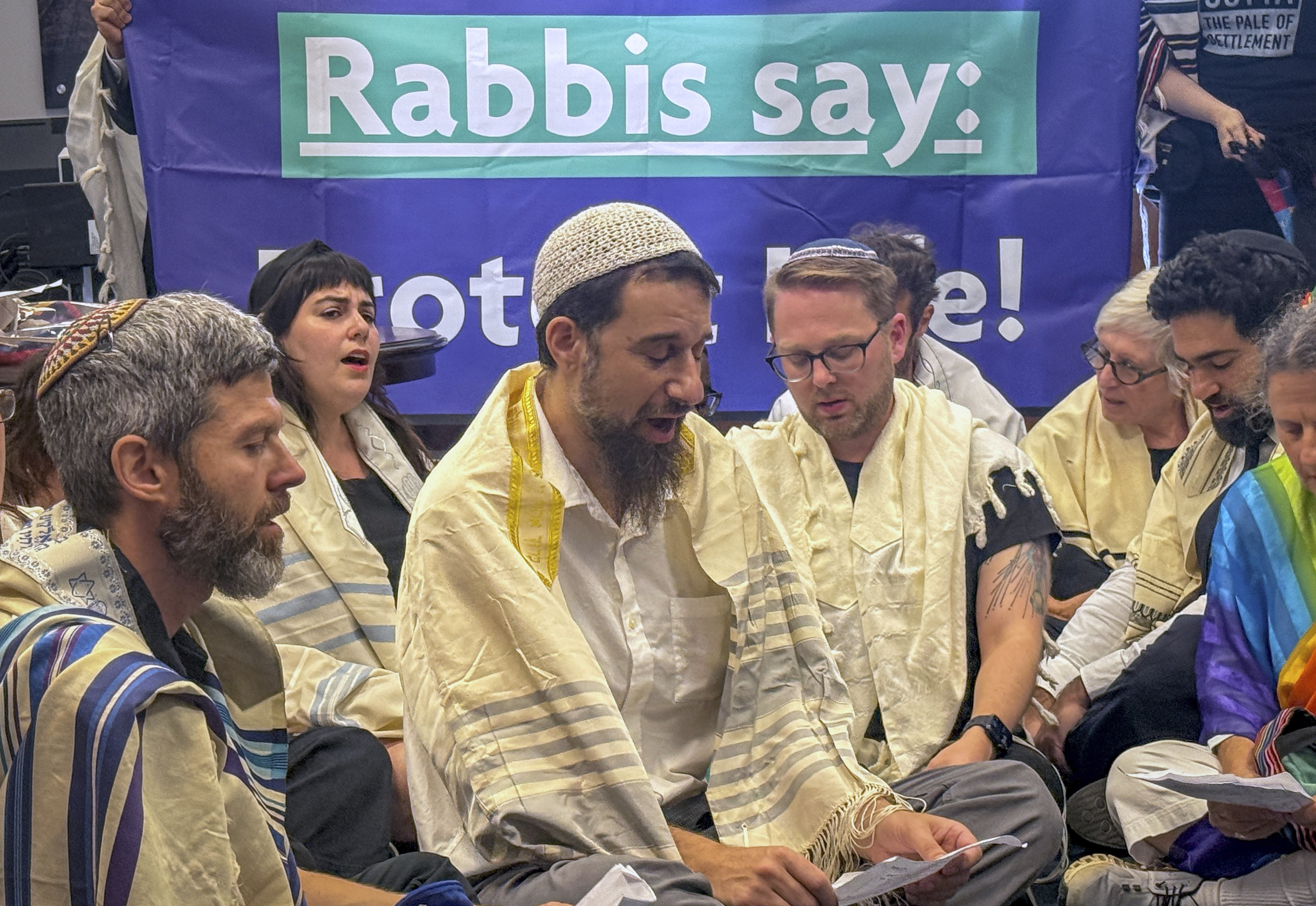In this image provided by Sue Dorfman, a group of Jewish clergy sit-in at the office of Senate Majority Leader John Thune, R-S.D., to bring attention to the situation in Gaza, Tuesday, July 29, 2025, at the Capitol in Washington. (Photo by Sue Dorfman via AP)