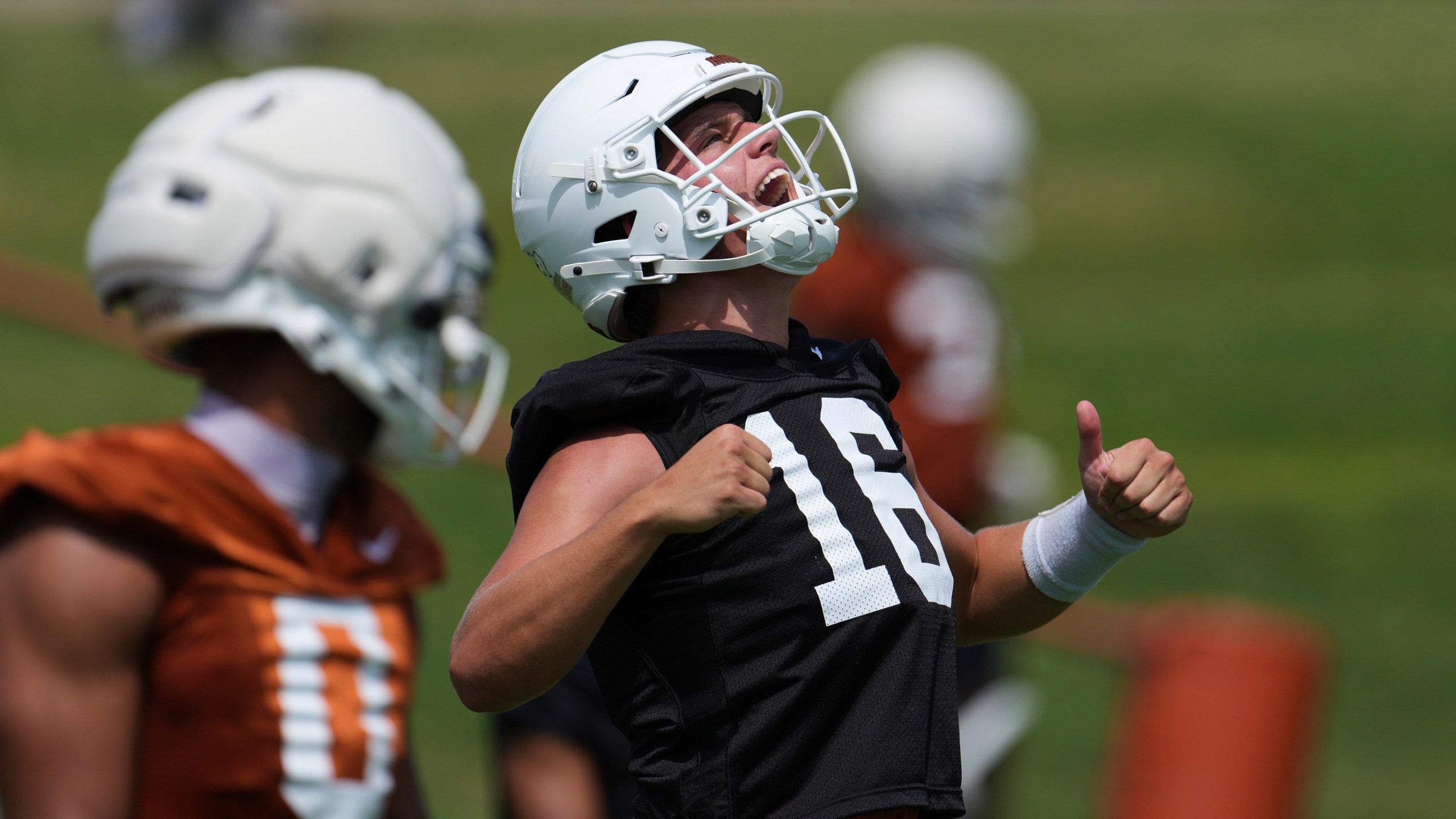 Texas quarterback Arch Manning (16) reacts during an NCAA college football practice in Austin, Texas, Wednesday, July 30, 2025. (AP Photo/Eric Gay)