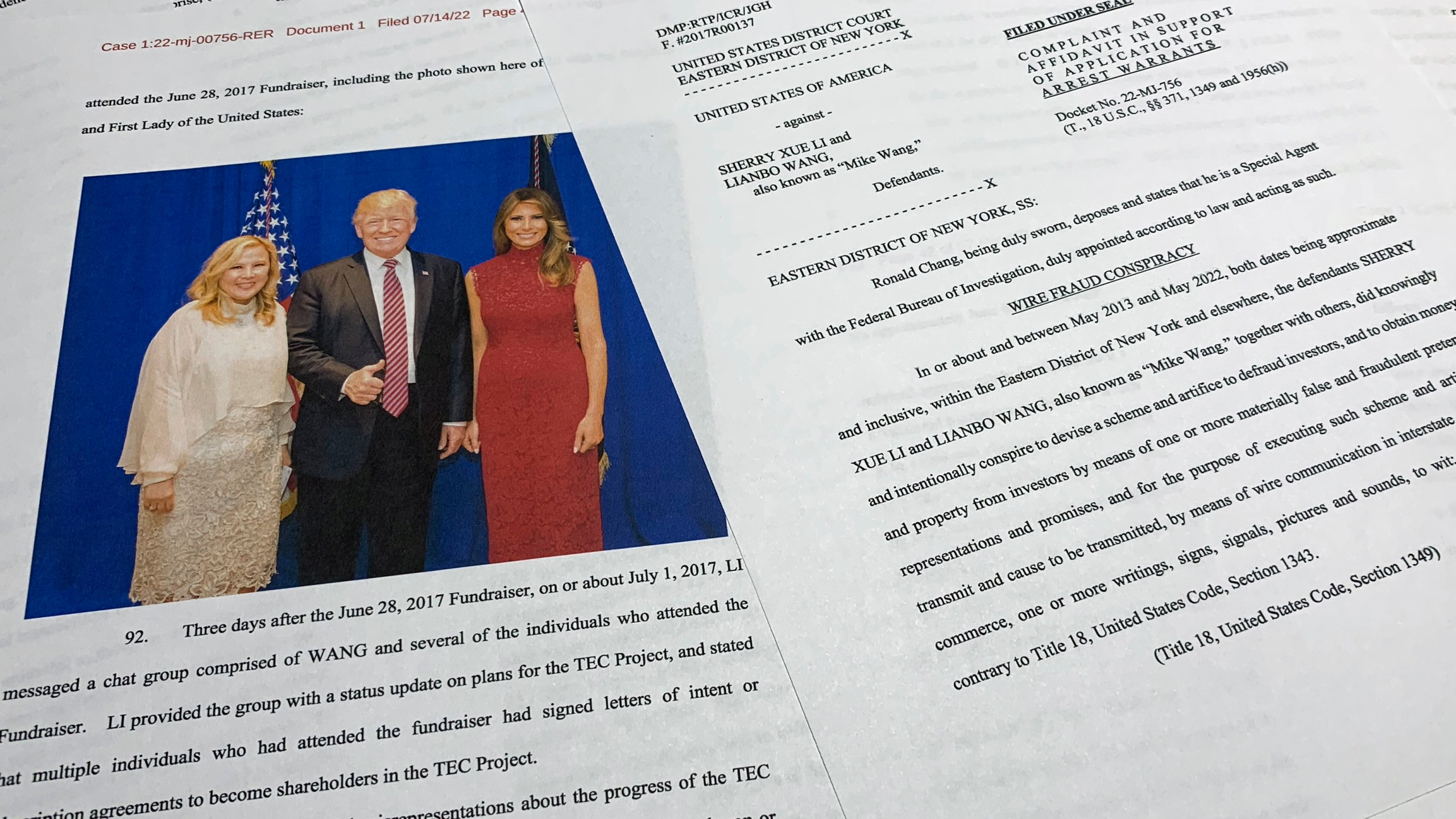 FILE - The complaint and affidavit in support of an arrest warrant against Sherry Xue Li and Lianbo "Mike" Wang is photographed on Monday, July 18, 2022. (Department of Justice via AP, File)