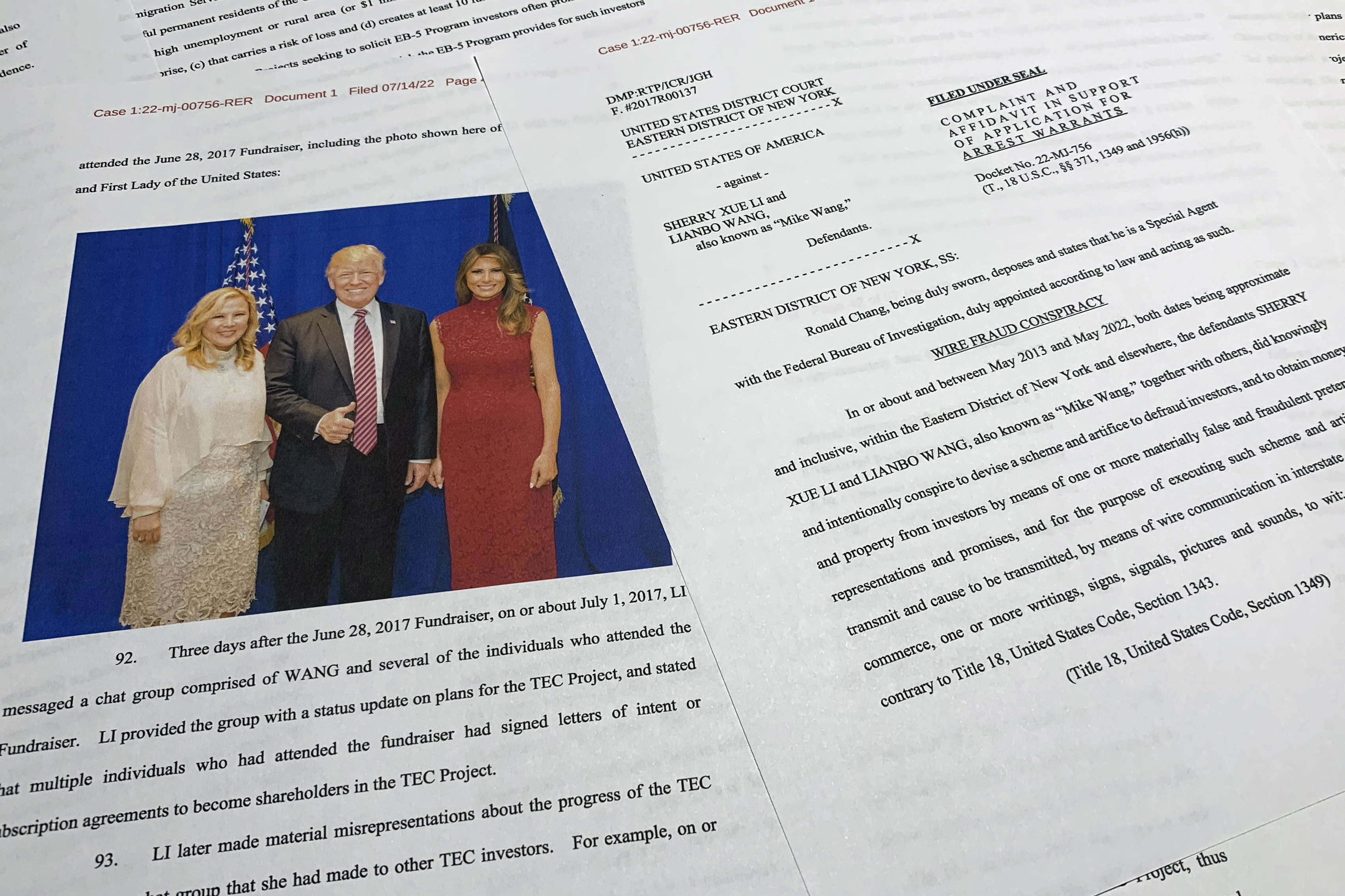 FILE - The complaint and affidavit in support of an arrest warrant against Sherry Xue Li and Lianbo "Mike" Wang is photographed on Monday, July 18, 2022. (Department of Justice via AP, File)