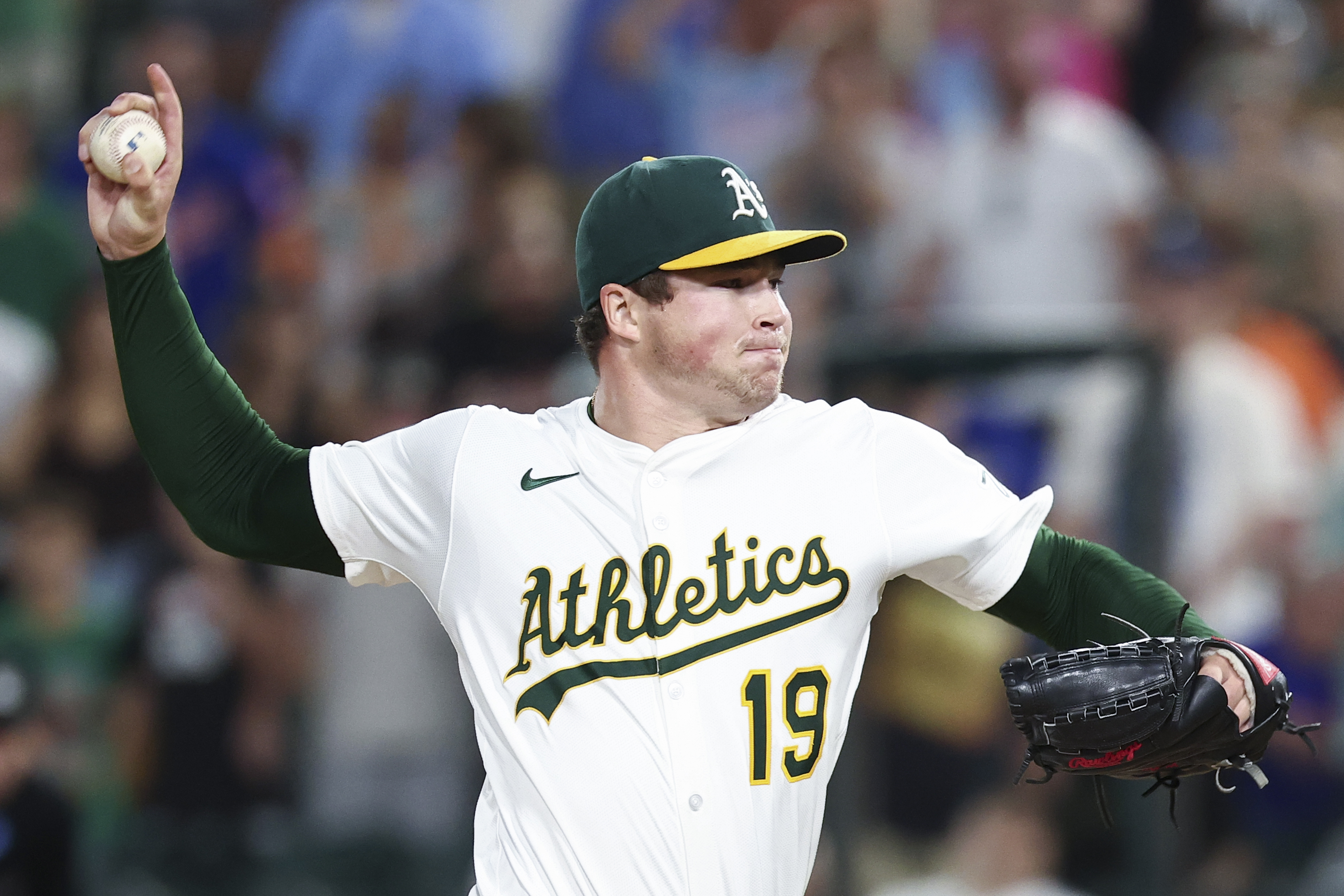 Athletics pitcher Mason Miller throws to the Toronto Blue Jays during the ninth inning of a baseball game Saturday, July 12, 2025, in West Sacramento, Calif. (AP Photo/Sara Nevis)
