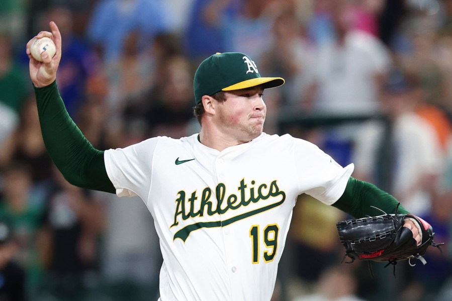 Athletics pitcher Mason Miller throws to the Toronto Blue Jays during the ninth inning of a baseball game Saturday, July 12, 2025, in West Sacramento, Calif. (AP Photo/Sara Nevis)
