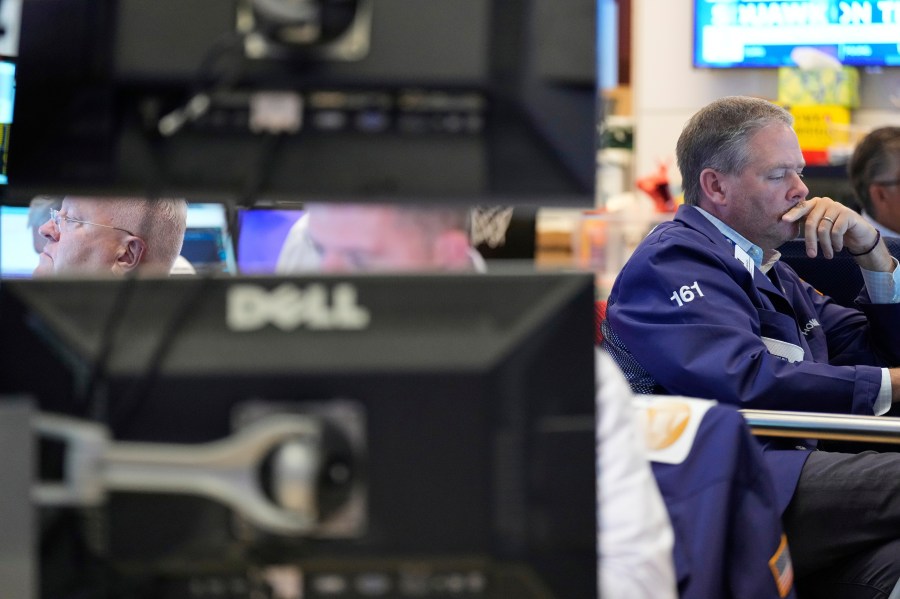 Traders work on the floor at the New York Stock Exchange in New York, Wednesday, July 30, 2025. (AP Photo/Seth Wenig)