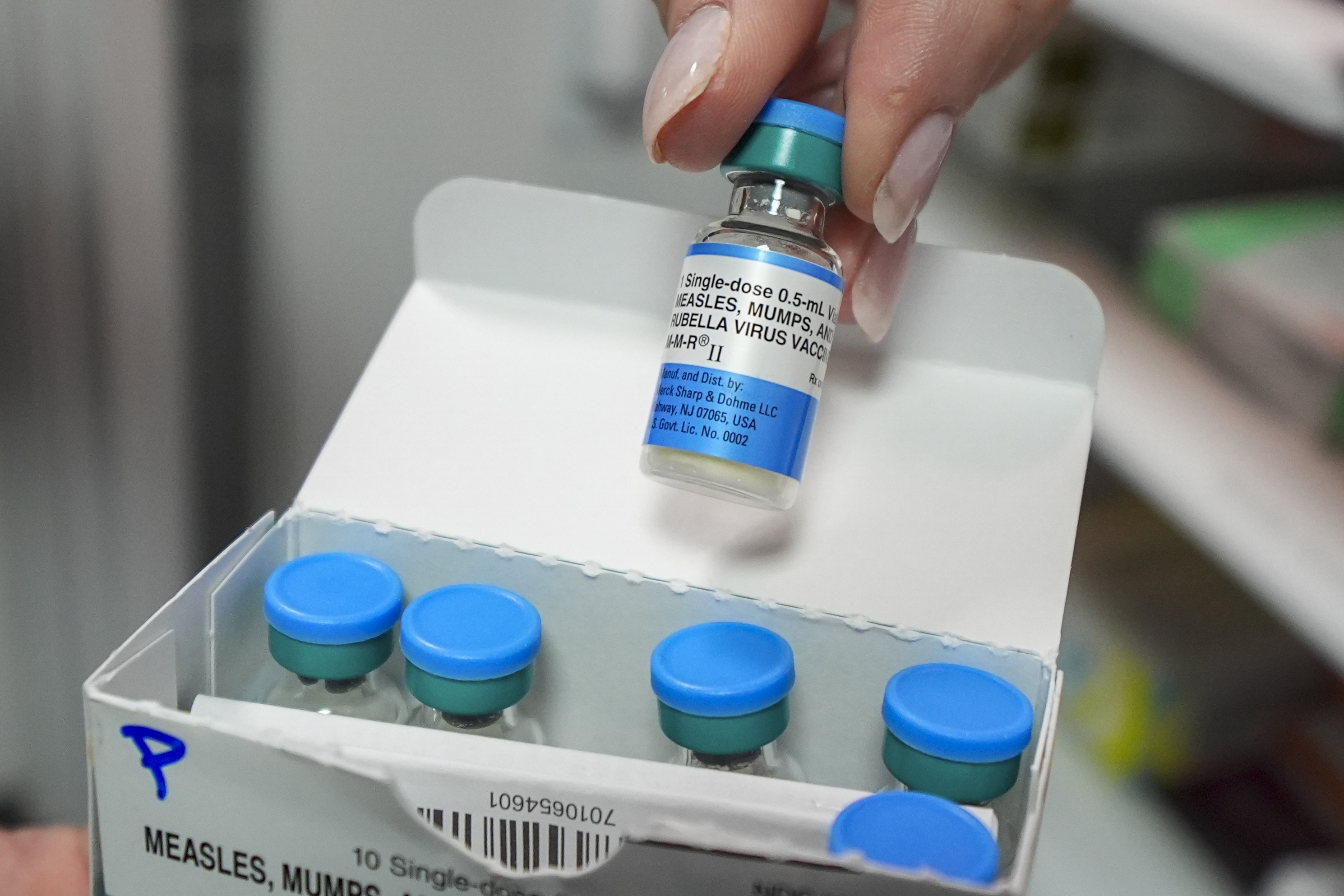 FILE - Vials of the measles mumps and rubella (MMR) vaccine are displayed in Lubbock, Texas, on Tuesday, Feb. 25, 2025. (AP Photo/Julio Cortez, File)