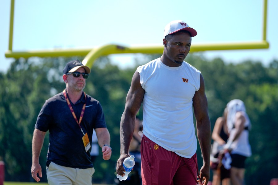 Washington Commanders wide receiver Terry McLaurin walks across the field after a practice at the team's NFL football training camp, Sunday, July 27, 2025, in Ashburn, Va. (AP Photo/Mark Schiefelbein)