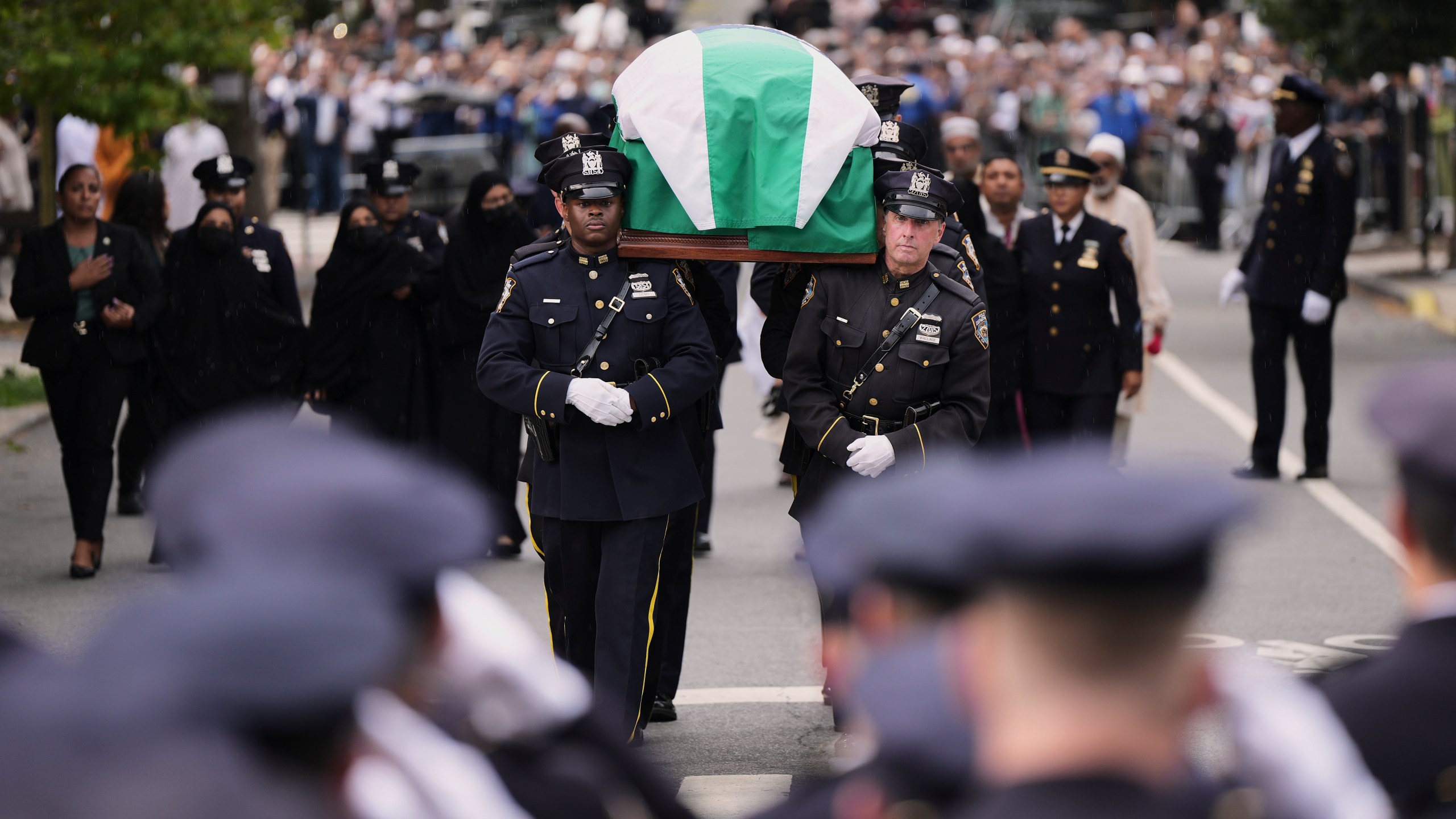 Pallbearers with the NYPD Ceremonial Unit carry the casket of officer Didarul Islam during his funeral, Thursday, July 31, 2025, in New York. (AP Photo/Angelina Katsanis)