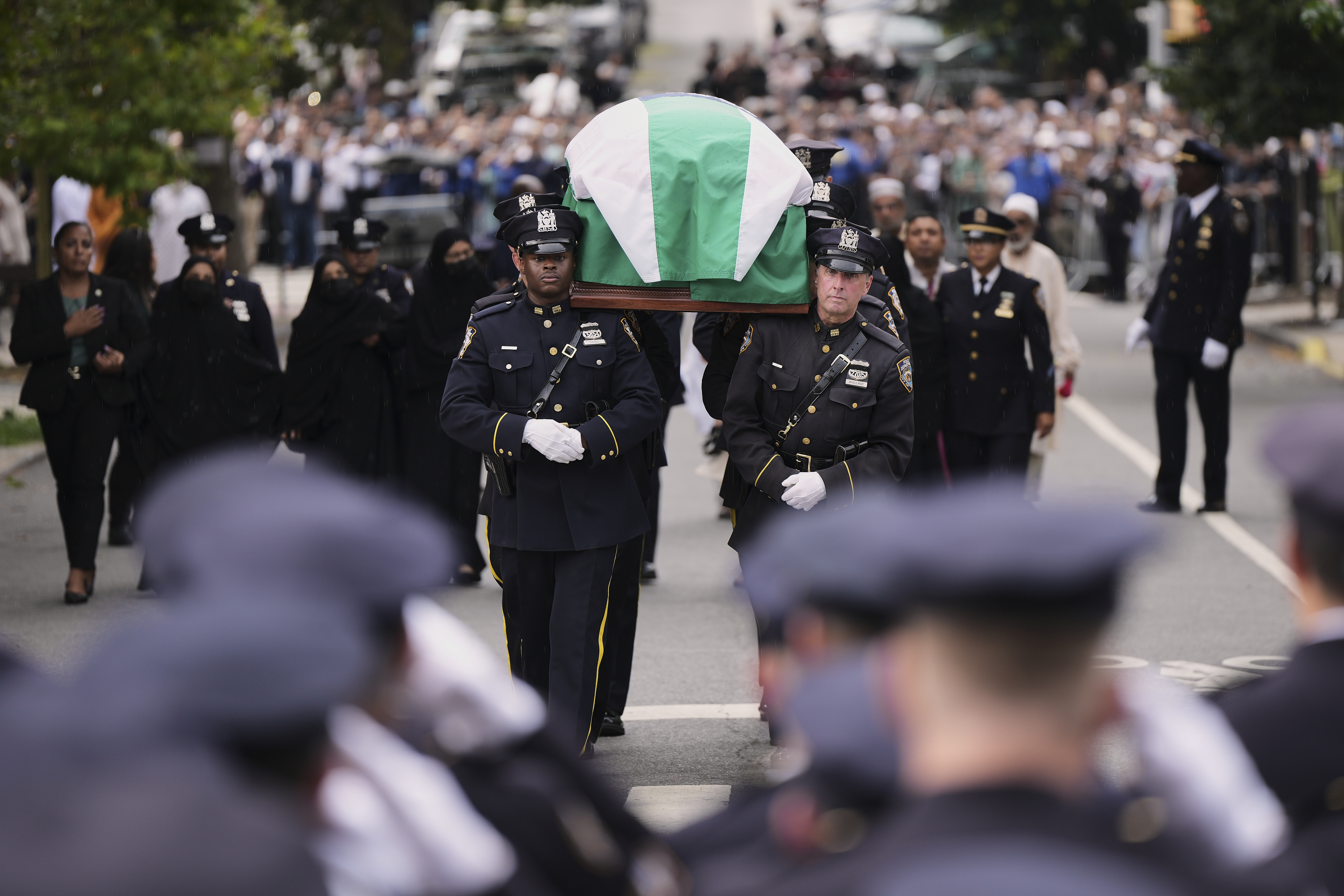 Pallbearers with the NYPD Ceremonial Unit carry the casket of officer Didarul Islam during his funeral, Thursday, July 31, 2025, in New York. (AP Photo/Angelina Katsanis)