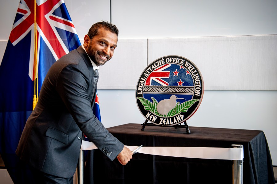 In this photo released by the US Embassy in Wellington, New Zealand, FBI Director Kash Patel cuts the ribbon at the official opening of the FBI office in Wellington, New Zealand, Thursday, July 31, 2025. (Ola Thorsen/US Embassy via AP)