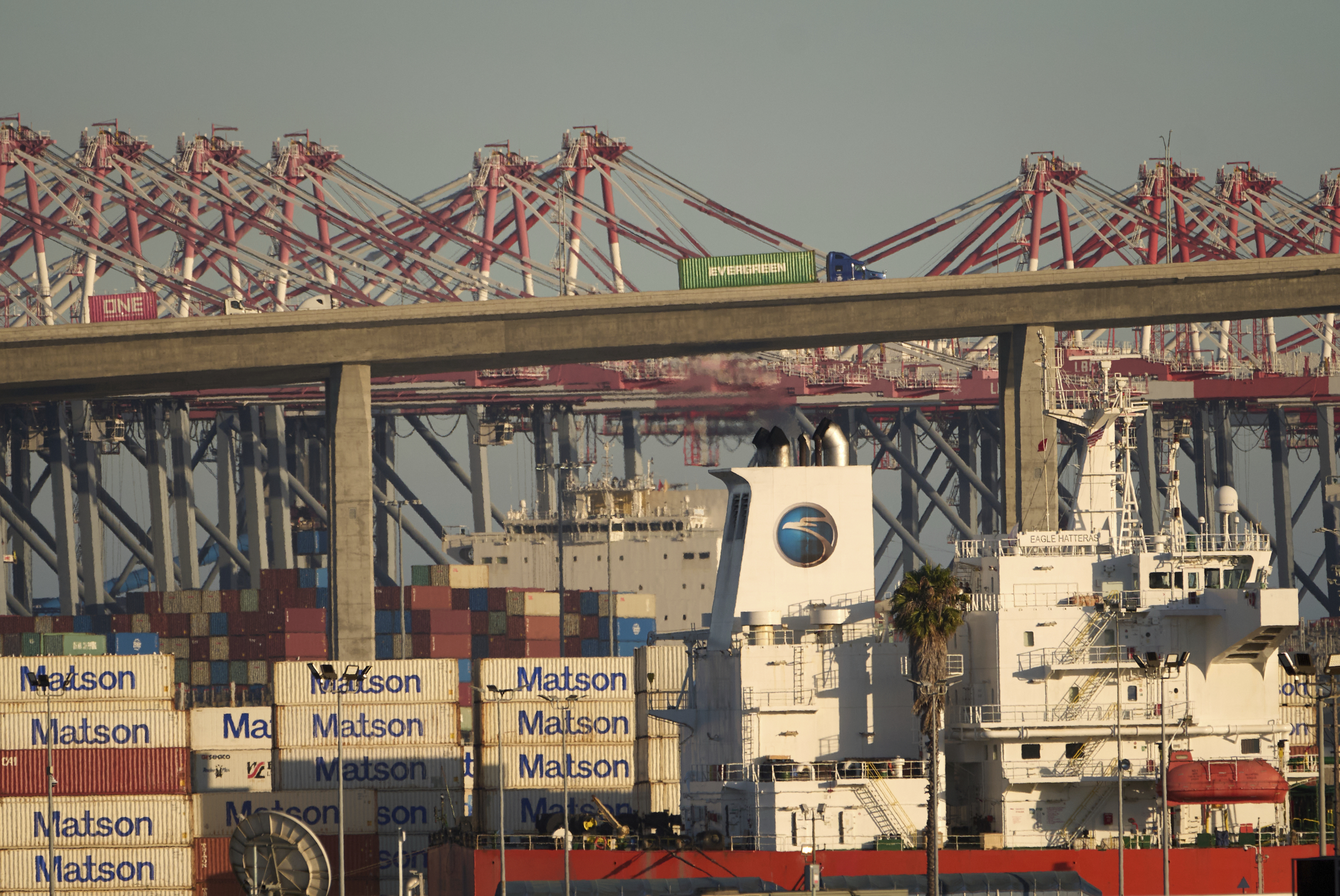 Shipping containers are stacked at the Matson terminal in the Port of Long Beach, Calif.,Thursday, July 31, 2025. (AP Photo/Damian Dovarganes)