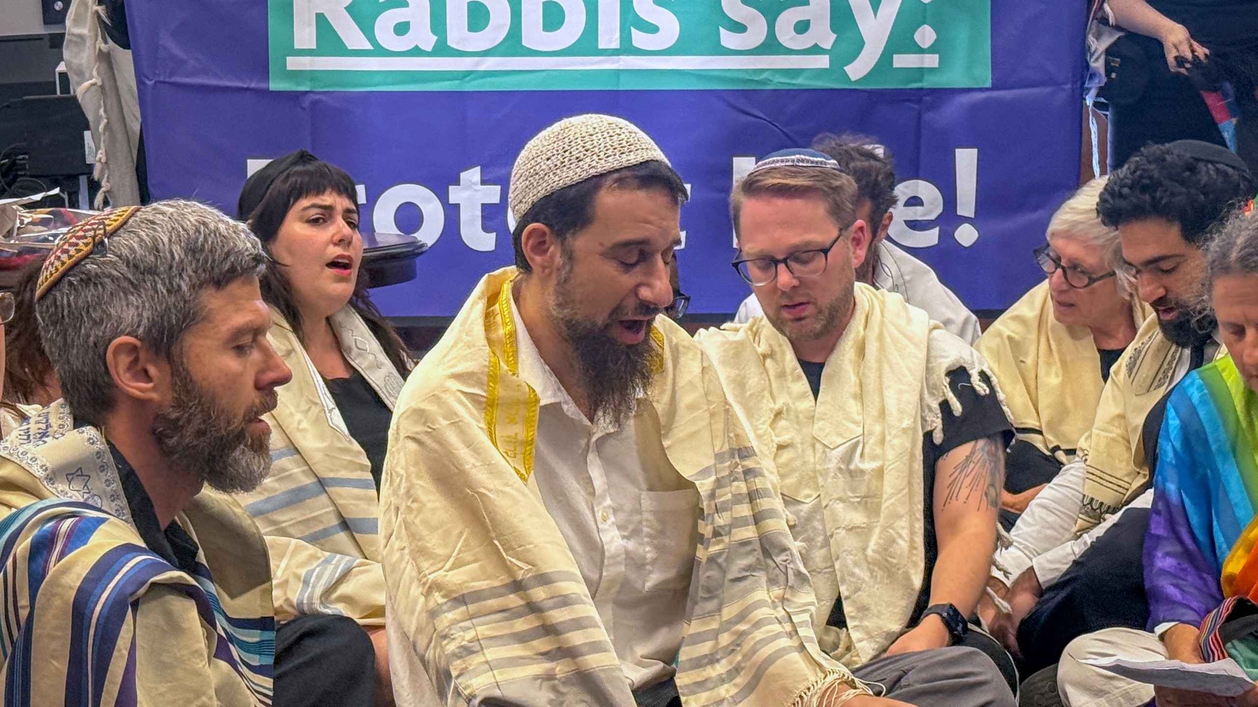 In this image provided by Sue Dorfman, a group of Jewish clergy sit-in at the office of Senate Majority Leader John Thune, R-S.D., to bring attention to the situation in Gaza, Tuesday, July 29, 2025, at the Capitol in Washington. (Photo by Sue Dorfman via AP)