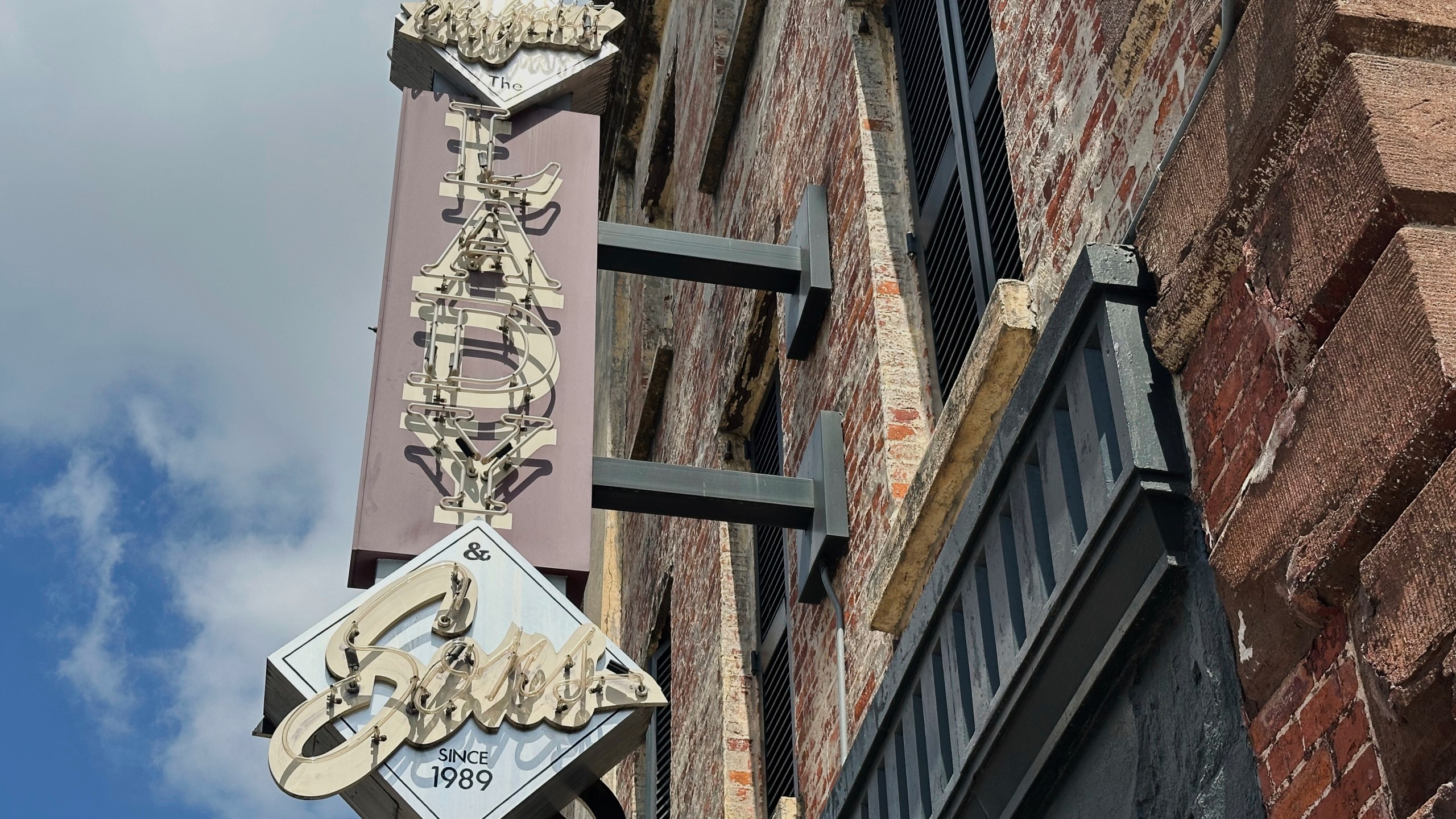 The sign outside Paula Deen's restaurant The Lady Sons is shown in Savannah, Ga. on Friday, Aug. 1, 2025. (AP Photo/Russ Bynum)