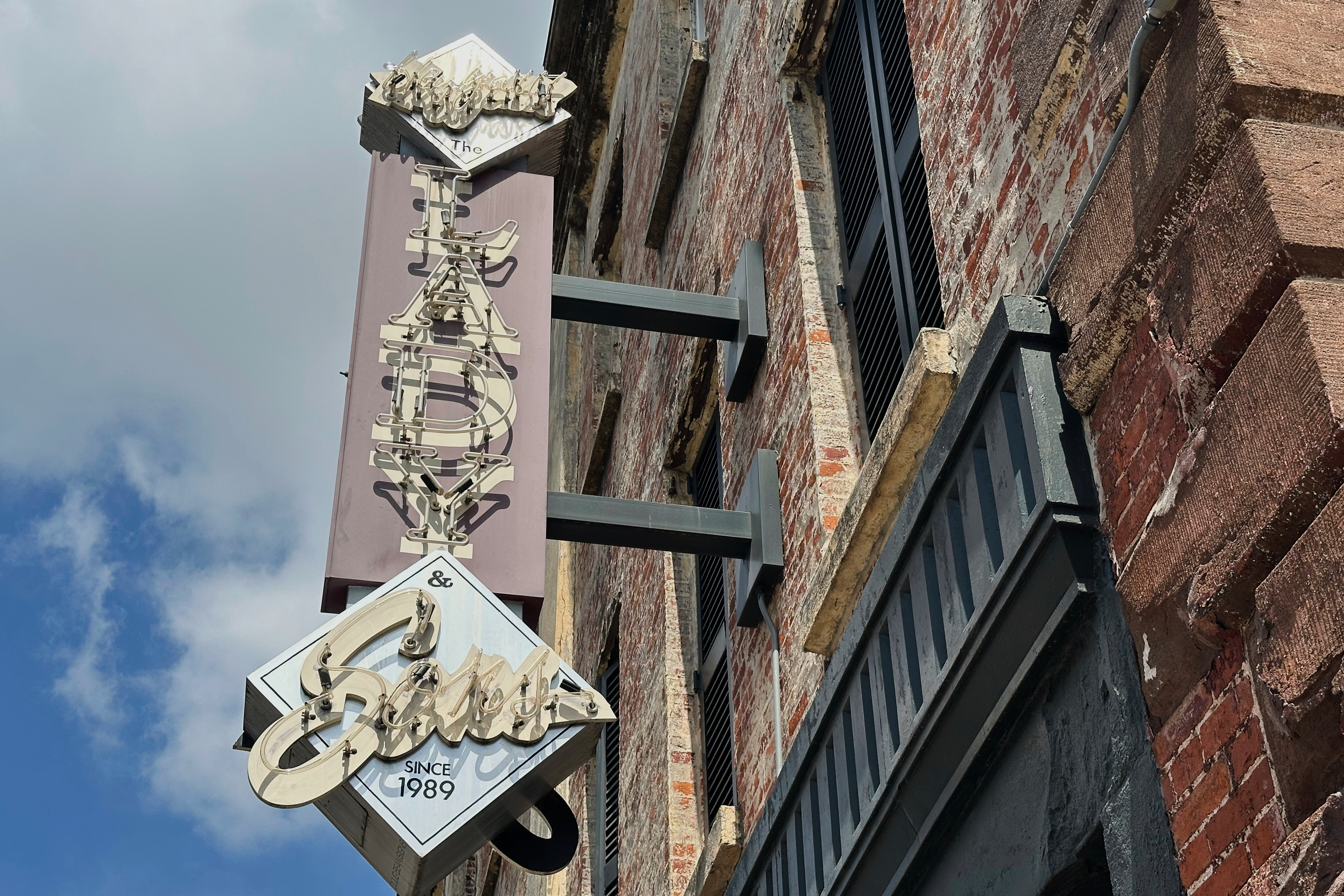 The sign outside Paula Deen's restaurant The Lady Sons is shown in Savannah, Ga. on Friday, Aug. 1, 2025. (AP Photo/Russ Bynum)