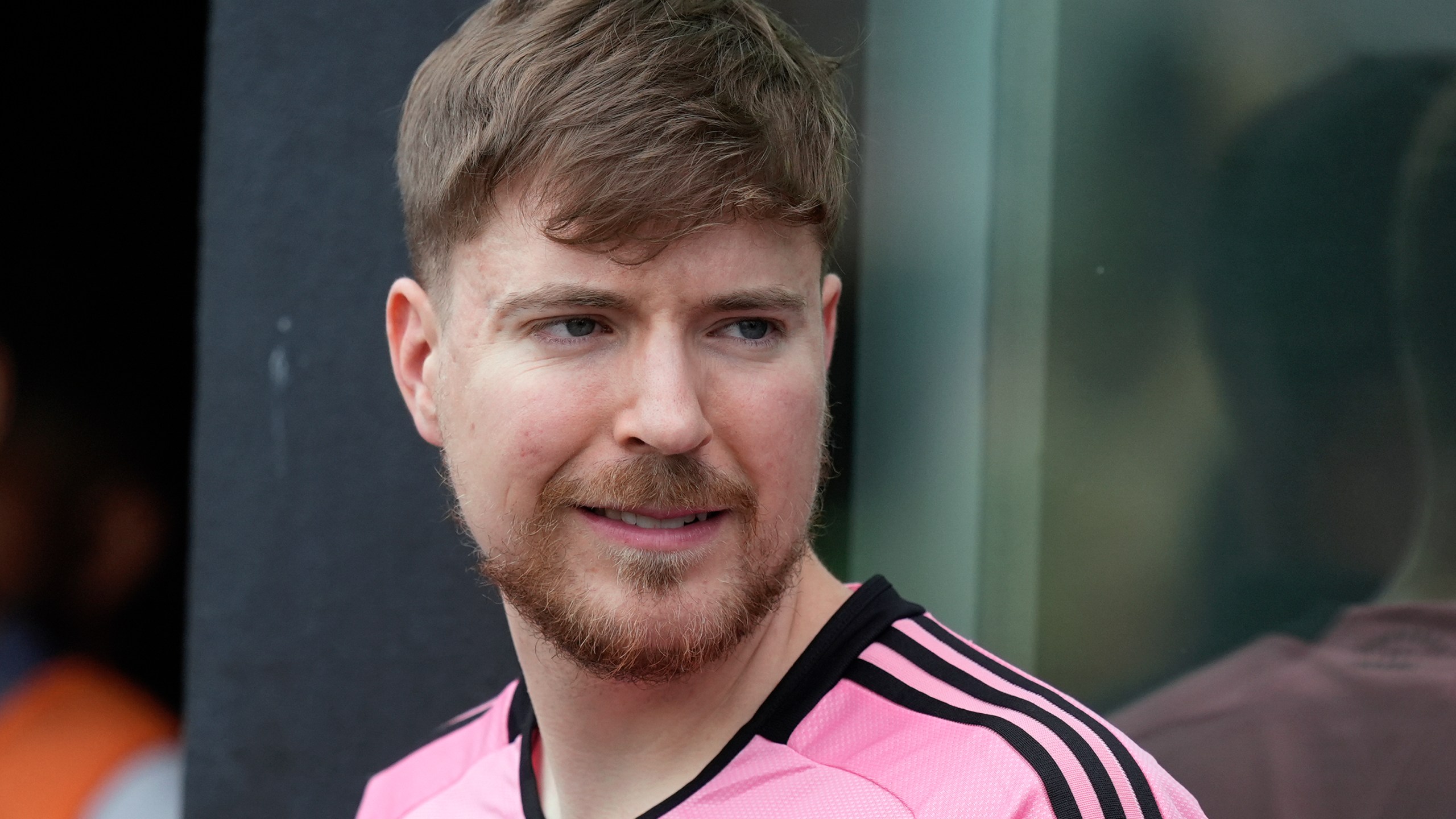 FILE - Jimmy Donaldson, the popular YouTube video maker who goes by MrBeast, wears a Lionel Messi jersey as he stands in a sideline box at the start of an MLS soccer match between Inter Miami and CF Montreal, March 10, 2024, in Fort Lauderdale, Fla. (AP Photo/Rebecca Blackwell, File)