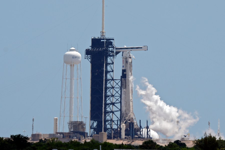 FILE - A SpaceX Falcon 9 rocket, with the crew Dragon capsule attached, vents fuel while sitting on Kennedy Space Center's Launch Pad 39-A, July 31, 2025, in Cape Canaveral, Fla. (AP Photo/Chris O'Meara, File)