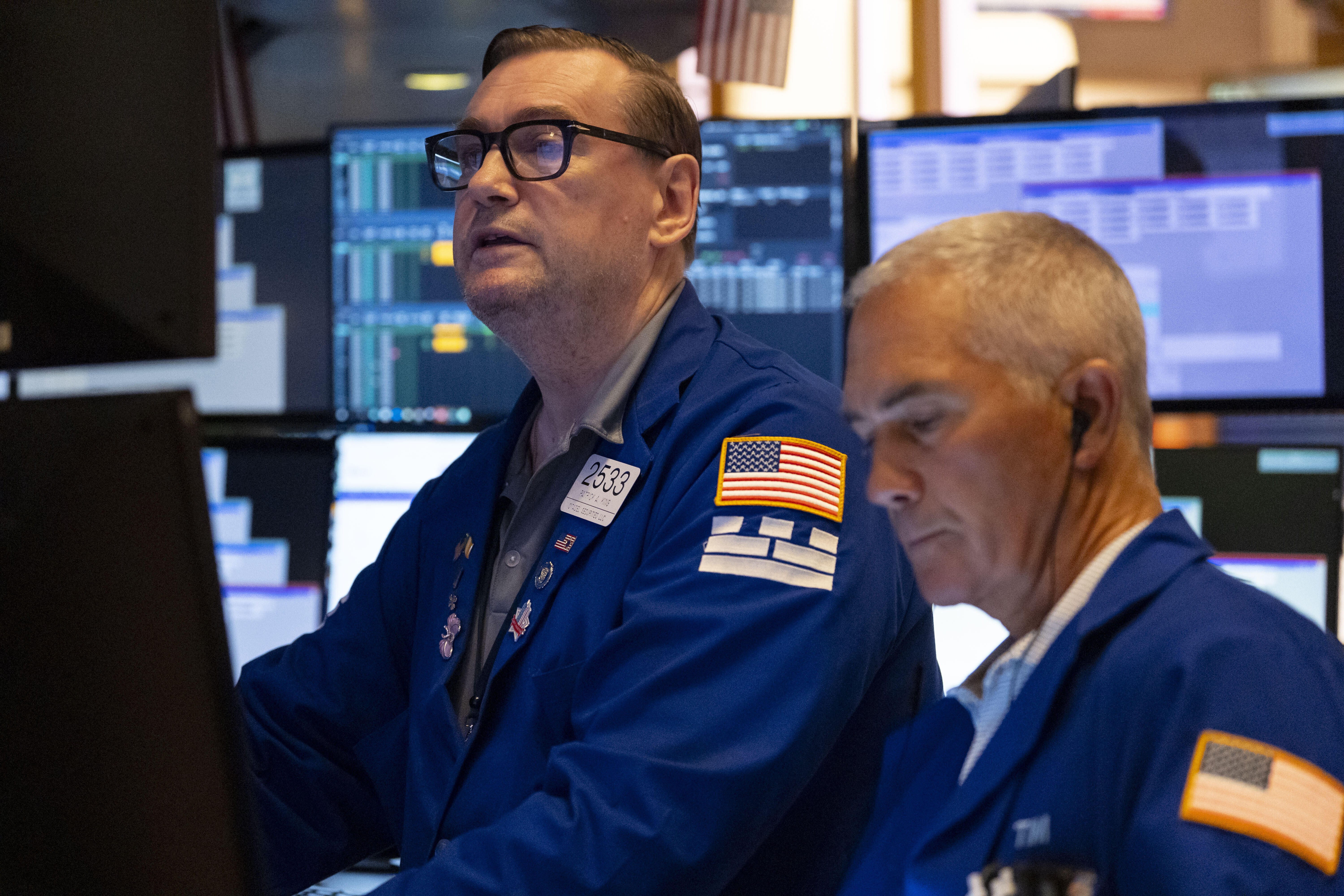 Traders work on the floor of the New York Stock Exchange, Friday, Aug. 1, 2025, in New York. (AP Photo/Yuki Iwamura)