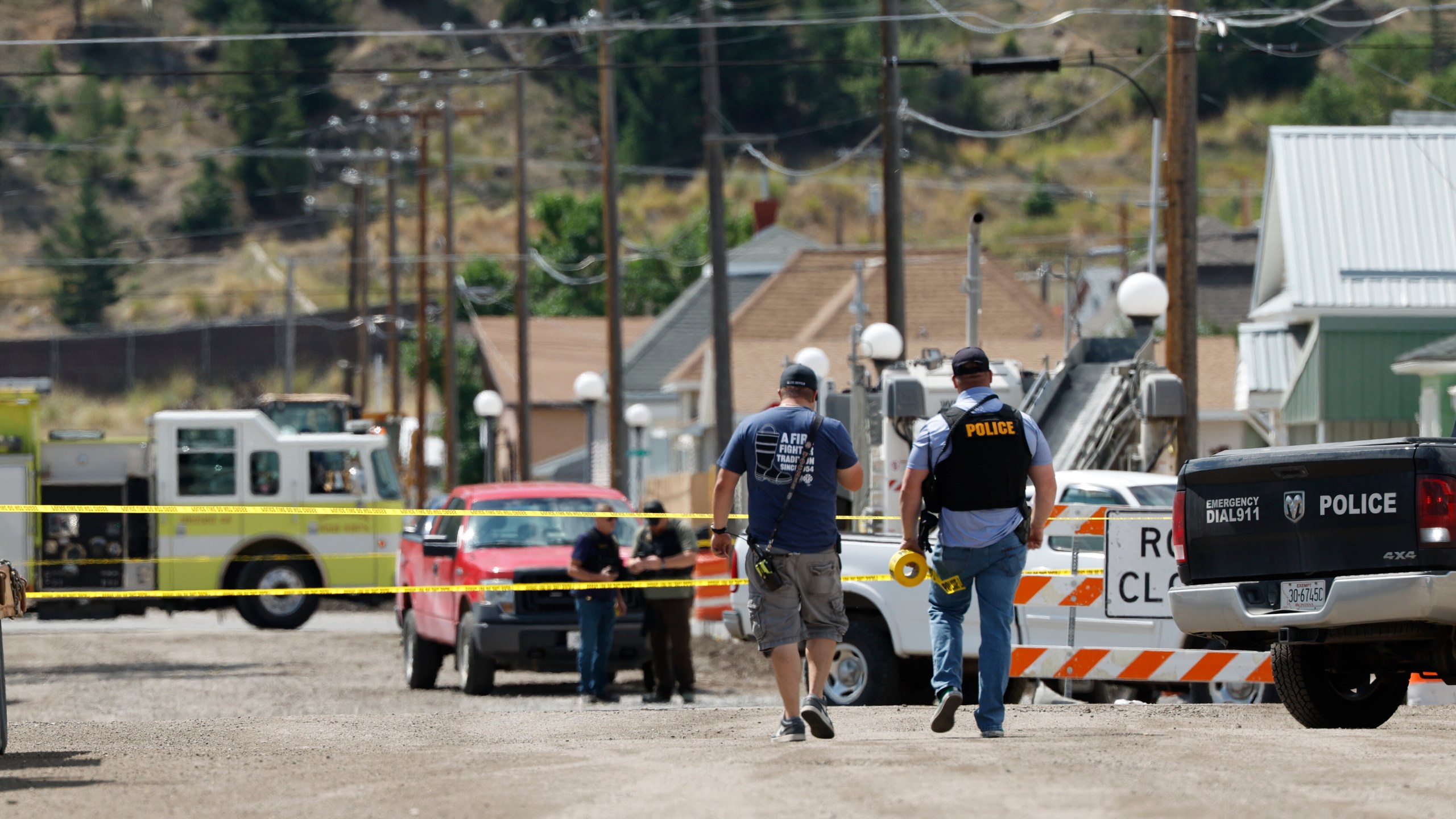 Police and other emergency personnel are seen after a reported shooting in Anaconda, Mont., Friday, Aug. 1, 2025. (Joseph Scheller/The Montana Standard via AP)