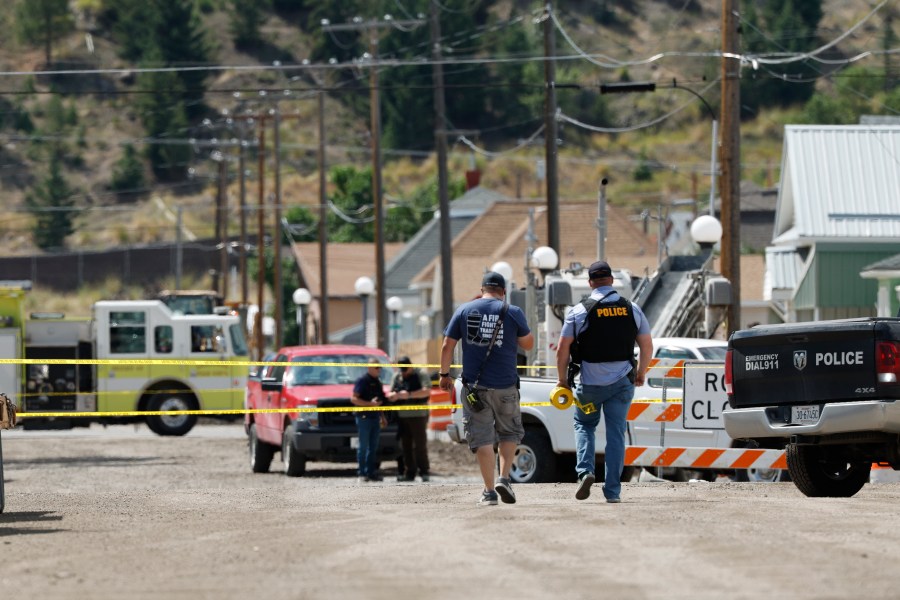 Police and other emergency personnel are seen after a reported shooting in Anaconda, Mont., Friday, Aug. 1, 2025. (Joseph Scheller/The Montana Standard via AP)